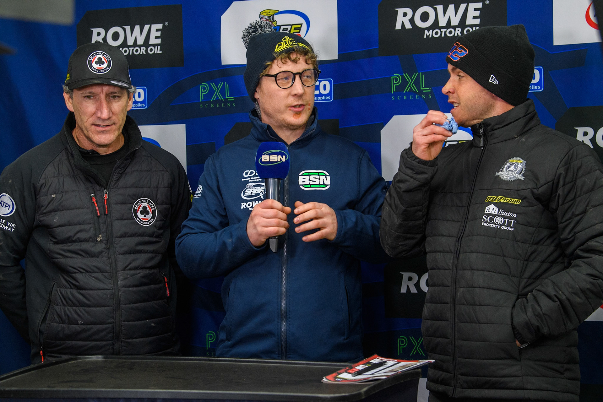 (L to R) Mark Lemon Team Manager of Belle Vue Aces, BSN Presenter Greg Blair and Ritchie Hawkins, Team Manager of Ipswich Witches as the managers announce their rider choices  for the final heat during the Premiership Cup Quarter Final 1st Leg match between Belle Vue Aces and Ipswich Witches at the National Speedway Stadium, Manchester on Monday 24th March 2025. (Photo: Ian Charles | MI News)