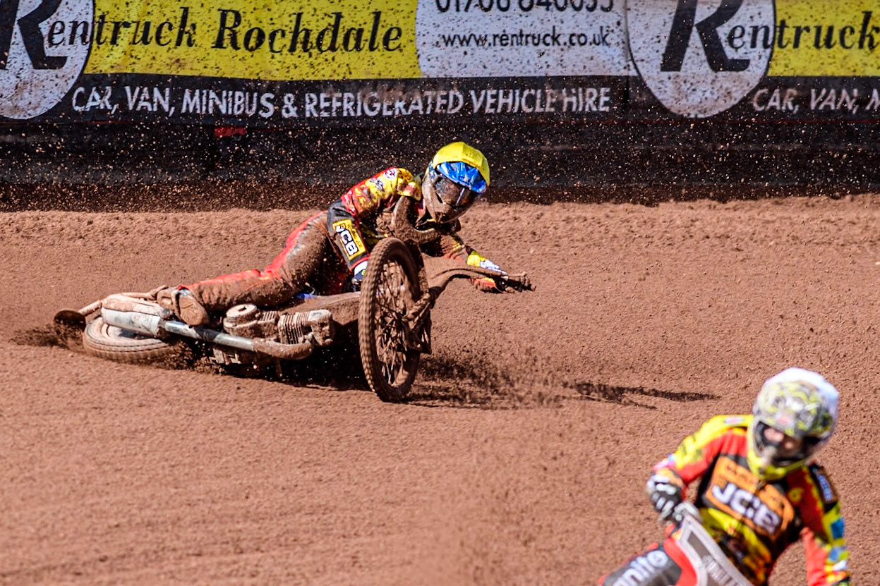 Leicester Lion Cubs' Sonny Springer  (Yellow) falls behind team mate Leicester Lion Cubs' Luke Crang (White) during the WSRA  National Development League match between Belle Vue Colts and Leicester Lion Cubs at the National Speedway Stadium, Manchester on Friday 29th March 2024. (Photo: Ian Charles | MI News)