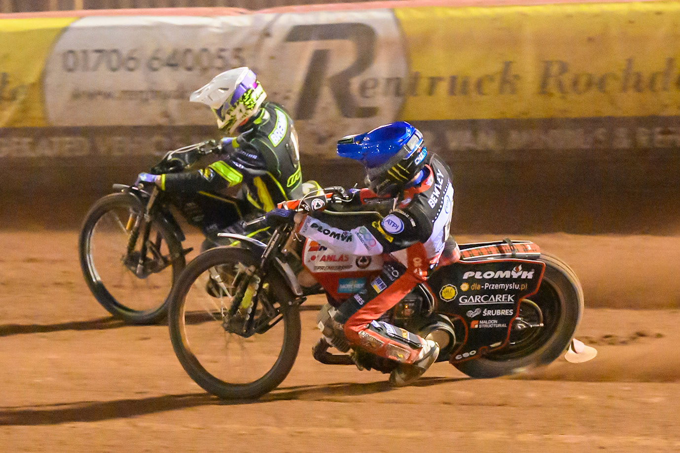 Dan Bewley of Belle Vue Aces  in Blue rides inside Tom Brennan of Ipswich Witches  in White during the Rowe Motor Oil Premiership match between Belle Vue Aces and Ipswich Witches at the National Speedway Stadium, Manchester on Monday 20th April 2026. (Photo: Ian Charles | MI News)