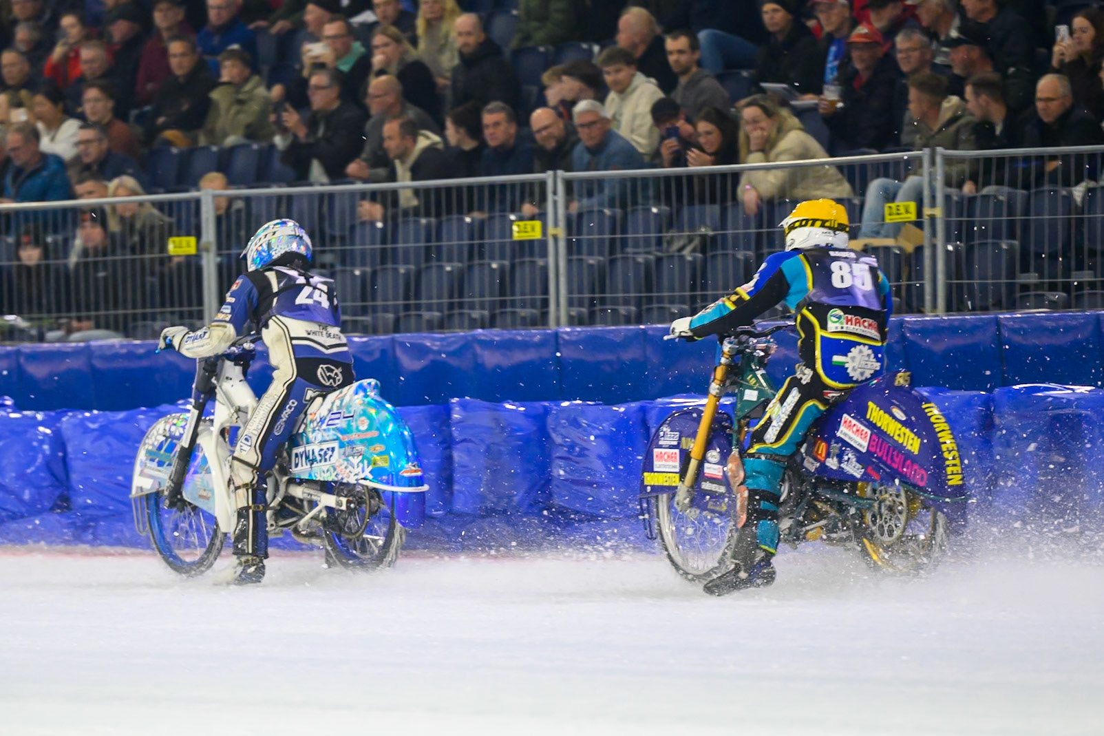 Luca Bauer (85) of Italy/Germany  in Yellow chases Max Koivula (24) of Finland  in White during the FIM Ice Speedway Gladiators World Championship Final 3 at Ice Rink Thialf, Heerenveen on Saturday 11th April 2026. (Photo: Ian Charles | MI News)