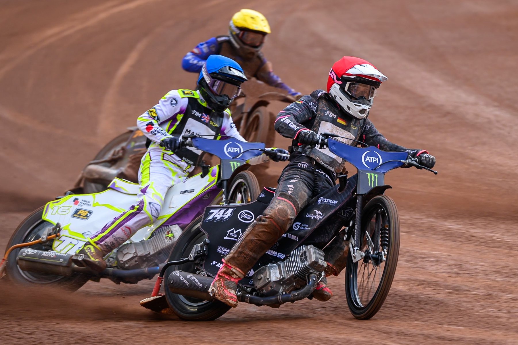 Kai Huckenbeck (744) of Germany in Red leading Wild Card Tom Brennan (16) of Great Britain in Blue and Nazar Parnitskyi (785) of Ukraine in Yellow during the ATPI  FIM Speedway GP of Manchester at the National Speedway Stadium, Manchester on Saturday 6th June 2026. (Photo: Ian Charles | MI News)