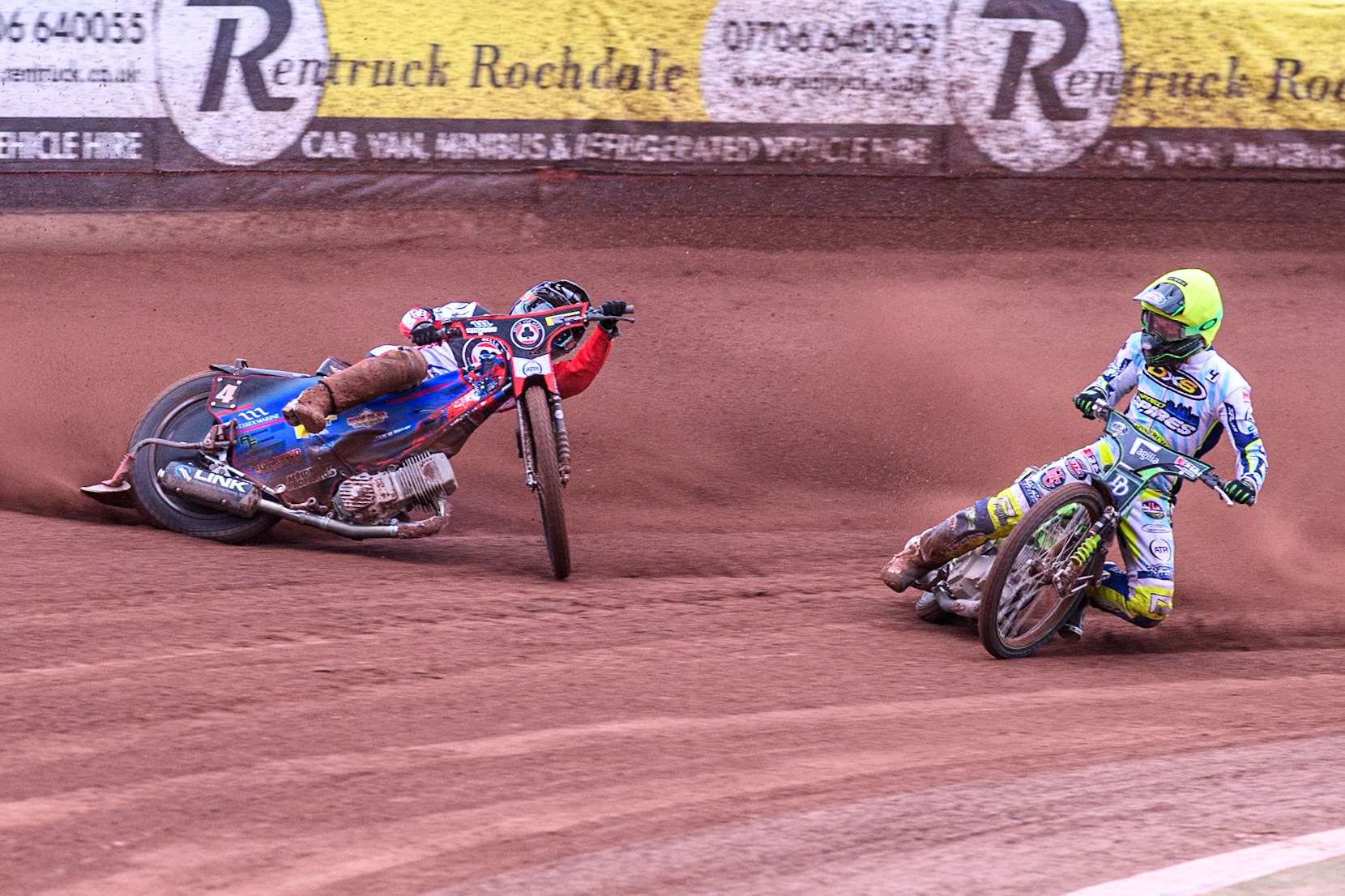 Belle Vue Aces' Ben Cook in Blue loses control after a tangle with Oxford Spires' Charles Wright in Yellow during the Rowe Motor Oil Premiership match between Belle Vue Aces and Oxford Spires at the National Speedway Stadium, Manchester on Monday 22nd July 2024. (Photo: Ian Charles | MI News)