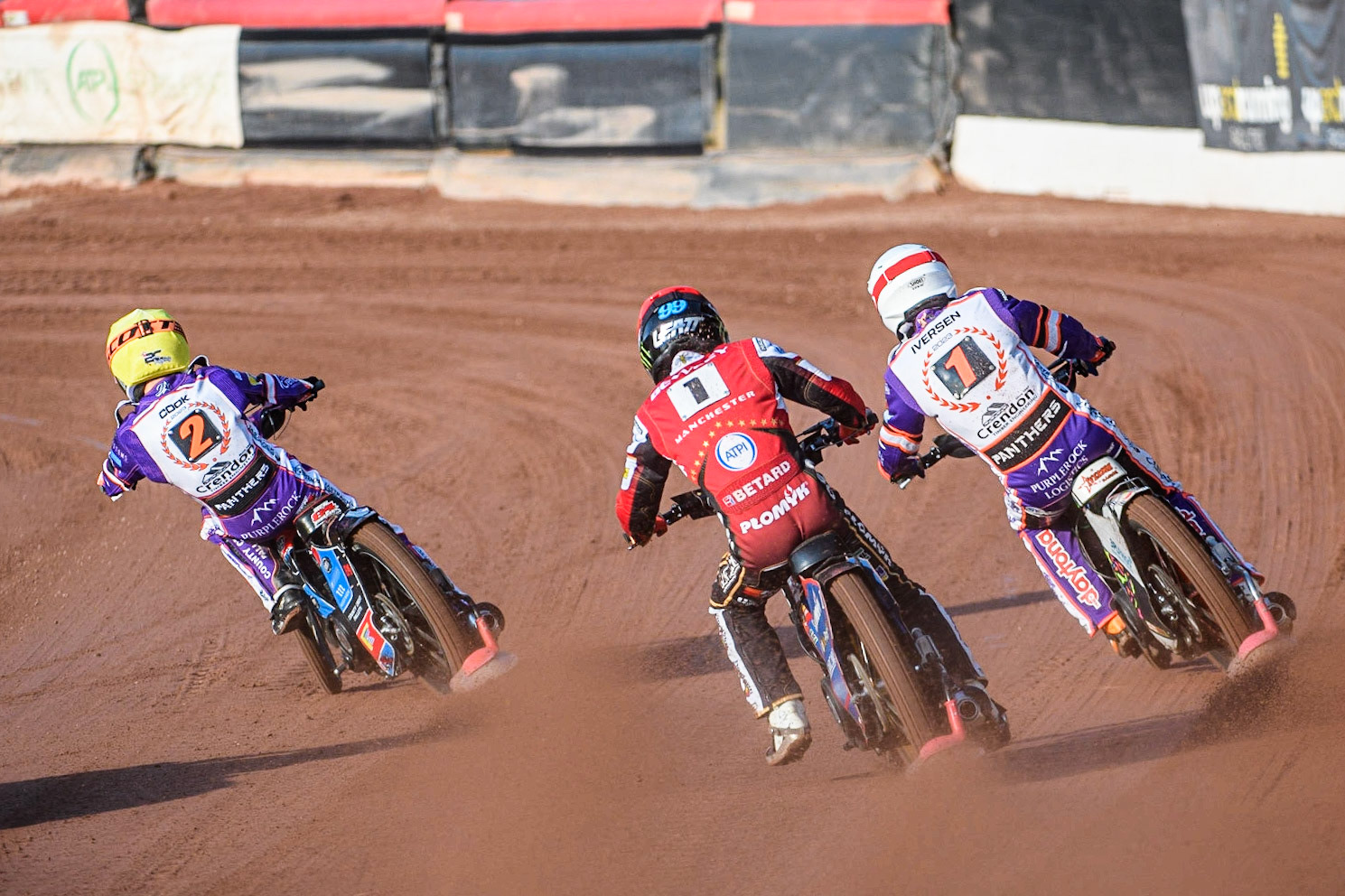 Dan Bewley (Red) chases Niels-Kristian Iversen  (White) and Ben Cook (Yellow) during the Sports Insure Premiership match between Belle Vue Aces and Peterborough at the National Speedway Stadium, Manchester on Monday 19th June 2023. (Photo: Ian Charles | MI News)