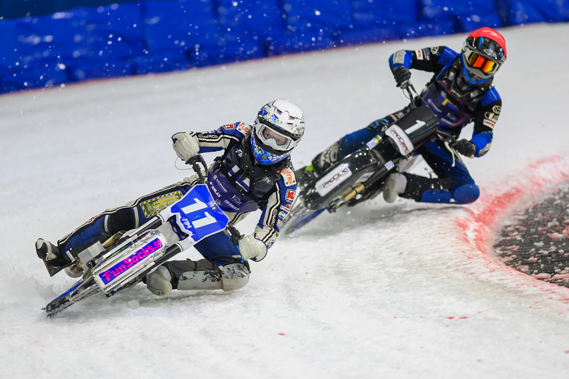 Max Koivula (11) of Finland  in White leading Niclas Svensson (1) of Sweden  in Red during the FIM Ice Speedway Of Nations at Ice Rink Thialf, Heerenveen on Sunday 12th April 2026. (Photo: Ian Charles | MI News)