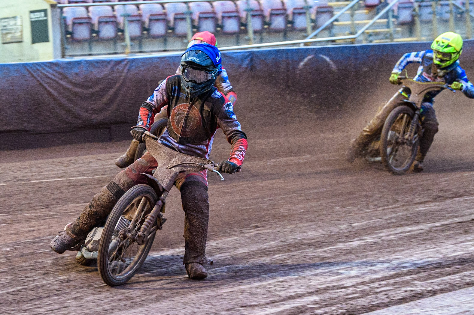 Belle Vue Colts' Matt Marson  in Blue leading Belle Vue Colts' William Cairns  in Red and Oxford Chargers' Jacob Clouting  in Yellow during the WSRA National Development League match between Belle Vue Colts and Oxford Chargers at the National Speedway Stadium, Manchester on Friday 2nd August 2024. (Photo: Ian Charles | MI News)
