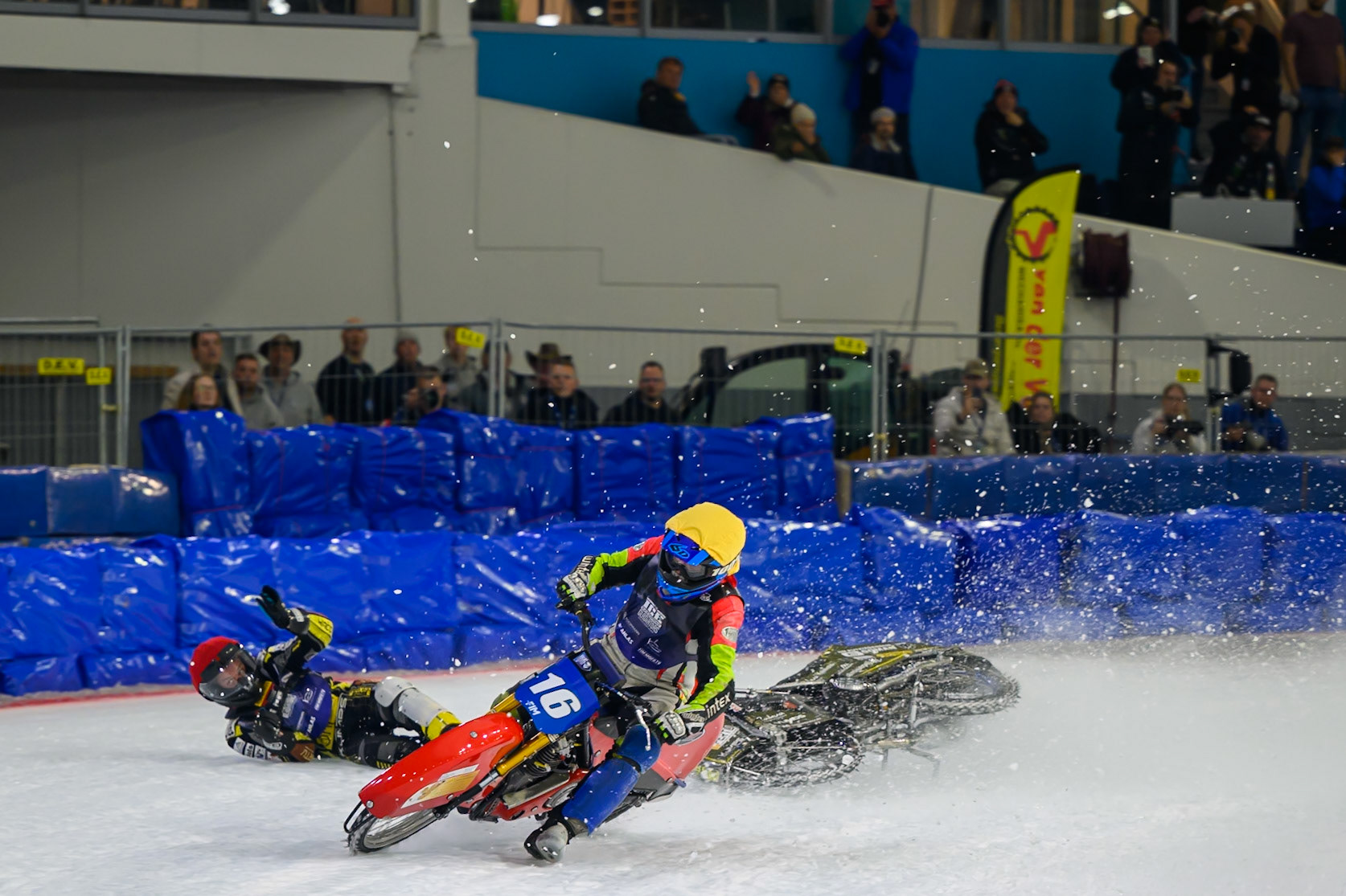 Heikki Huusko (67) of Finland  collides with Wild Card Harald Simon (16) of Austria in Yellow in the first turn during the FIM Ice Speedway Gladiators World Championship Final 3 at Ice Rink Thialf, Heerenveen on Saturday 11th April 2026. (Photo: Ian Charles | MI News)