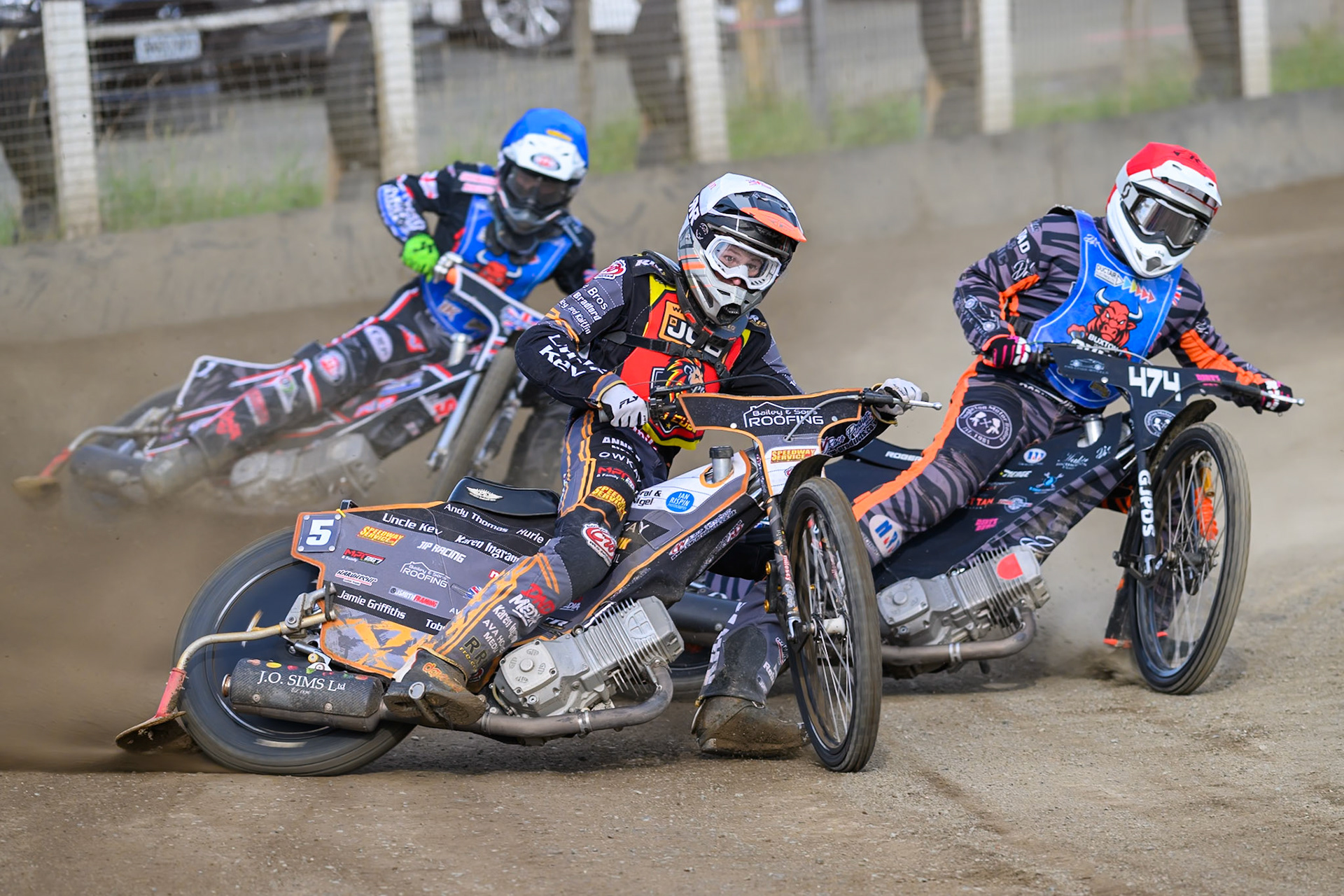 Ryan Ingram of Leicester Lion Cubs   in White leading Jack Roberts of Buxton Bulls   in Red  and Jack Shimelt of Buxton Bulls  in Blue during the WSRA National Development League match between Buxton Bulls and Leicester Lion Cubs at Hi-Edge Speedway, Buxton on Sunday 4th October 2026. (Photo: Ian Charles | MI News)