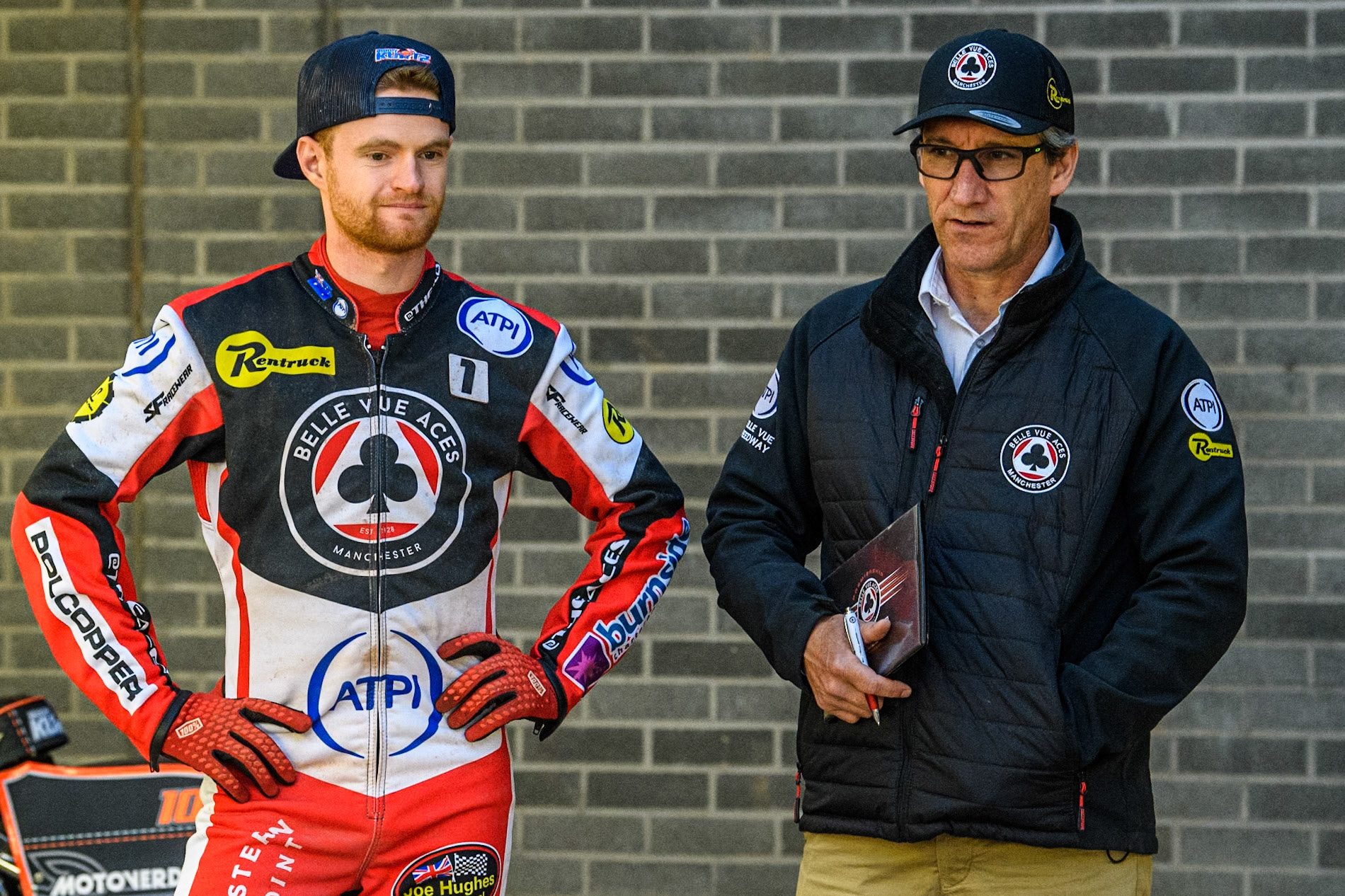 Belle Vue Aces' Brady Kurtz (Left) with Belle Vue Aces' Team Manager Mark Lemon  during the Rowe Motor Oil Premiership match between Belle Vue Aces and King's Lynn Stars at the National Speedway Stadium, Manchester on Monday 20th May 2024. (Photo: Ian Charles | MI News)