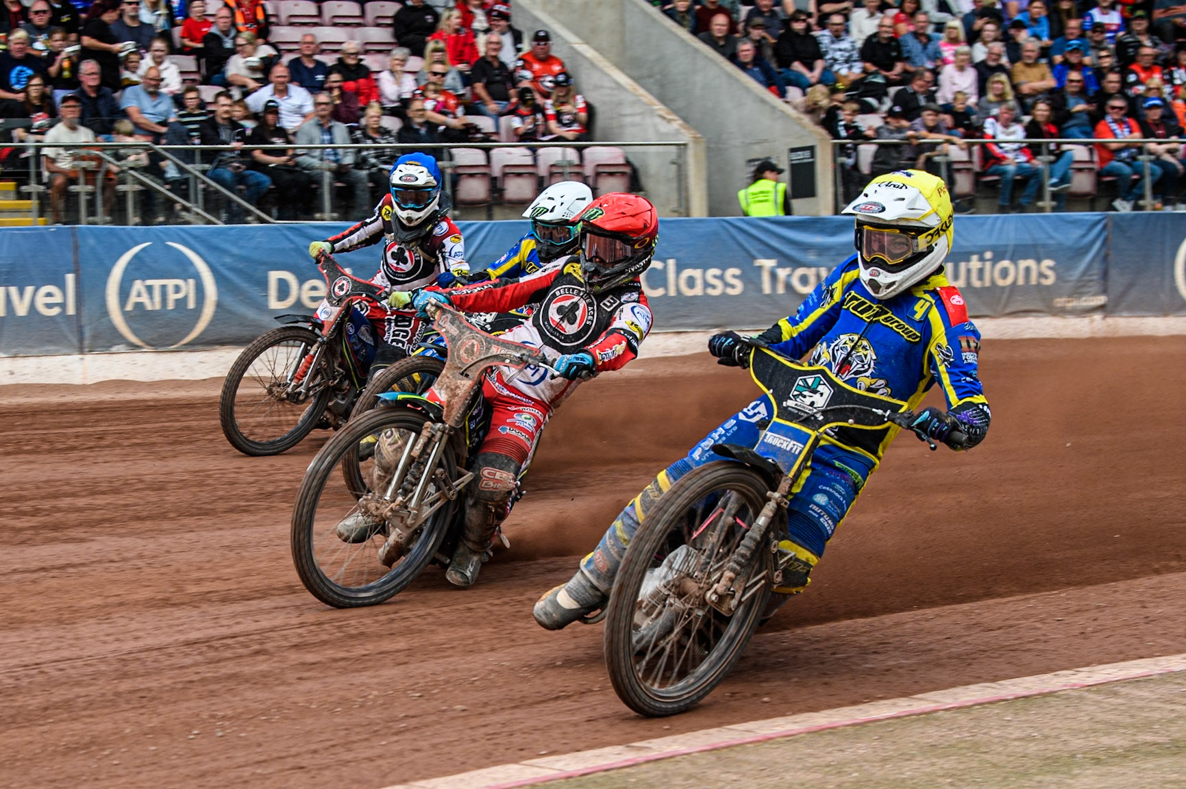 Sheffield Tigers' Josh Pickering in Yellow rides inside Belle Vue Aces' Jaimon Lidsey  in Red Sheffield Tigers' Chris Holder  in White and Belle Vue Aces' Jake Mulford in White during the Rowe Motor Oil Premiership match between Belle Vue Aces and Sheffield Tigers at the National Speedway Stadium, Manchester on Monday 26th August 2024. (Photo: Ian Charles | MI News)