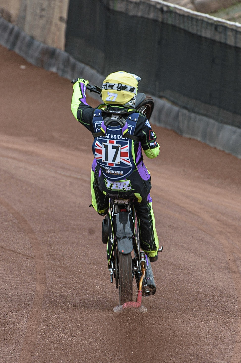 GLASGOW, UK. JUNE 19TH.  Tom Brennan (Reserve) (Great Britain)celebrates his second place in heat 1 with a wheelie during the FIM Speedway Grand Prix Qualifying Round at the Peugeot Ashfield Stadium, Glasgow on Saturday 19th June 2021. (Credit: Ian Charles | MI News)