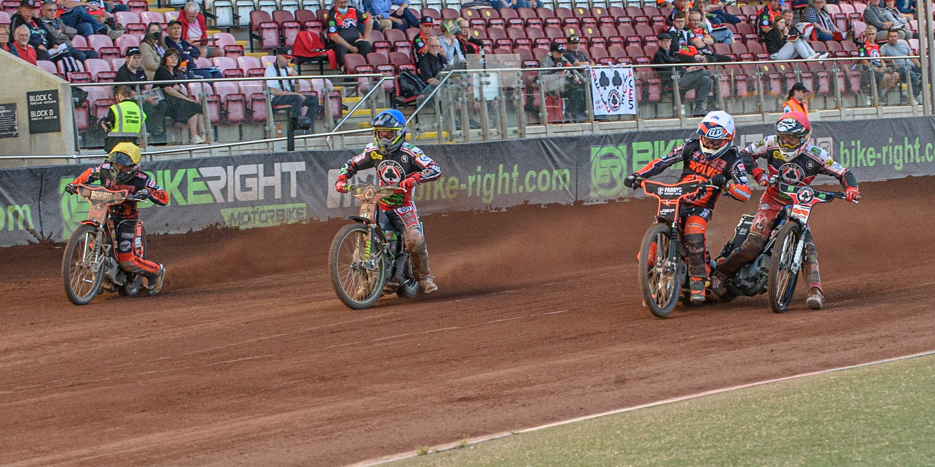 MANCHESTER, UK. JULY 15TH   Sam Masters  (White) causes Dan Bewley  (Red) to swerve as Charles Wright  (Blue) tries to out gate Luke Becker (Yellow) during the SGB Premiership match between Belle Vue Aces and Wolverhampton Wolves at the National Speedway Stadium, Manchester on Thursday 15th July 2021. (Credit: Ian Charles | MI News)