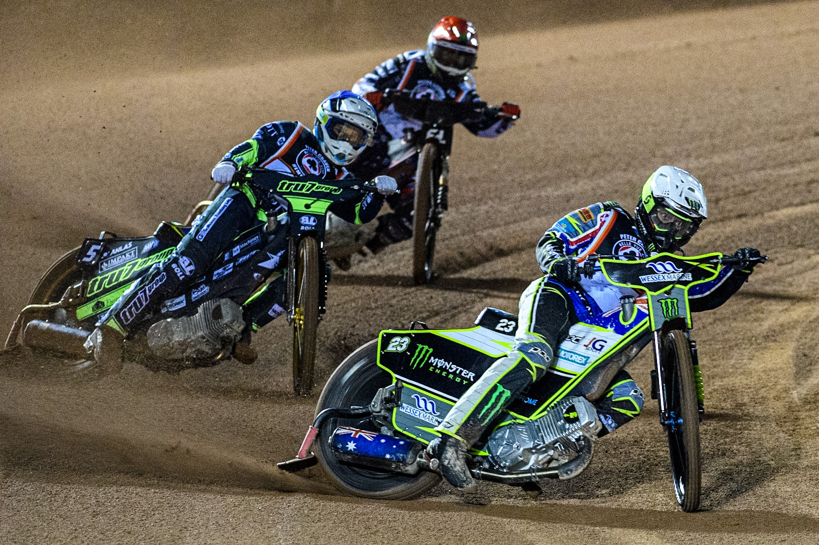 Chris Holder in White leading Jason Doyle in Blue and Freddie Lindgren in Red during the Peter Craven Memorial Trophy at the National Speedway Stadium, Manchester on Monday 17th March 2025. (Photo: Ian Charles | MI News)