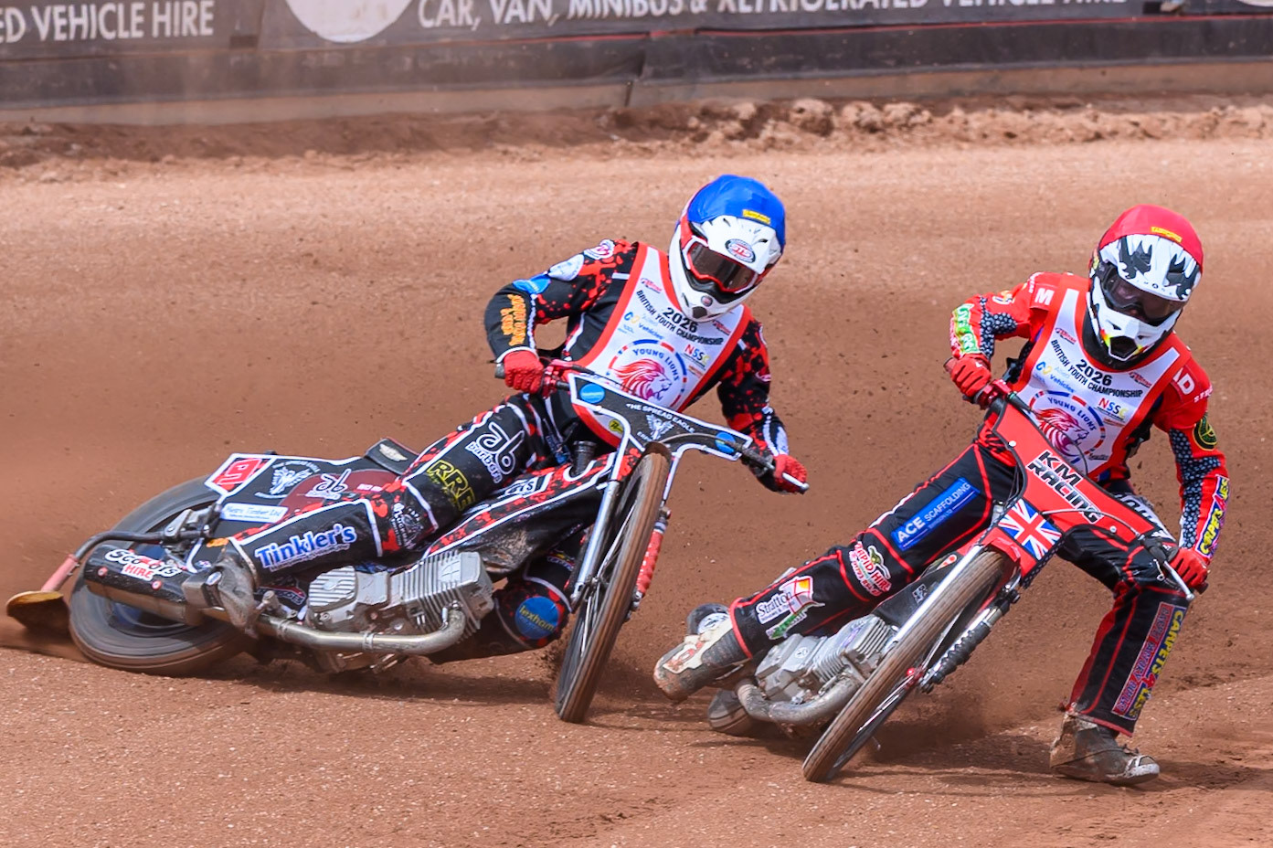 BRITISH YOUTH CHAMPIONSHIP (500cc): Kayden Mundy (8) in Red rides inside Dylan Huthwaite (9)  in Blue who then falls during the British Youth Speedway Championship at the National Speedway Stadium, Manchester on Sunday 10th May 2026. (Photo: Ian Charles | MI News)