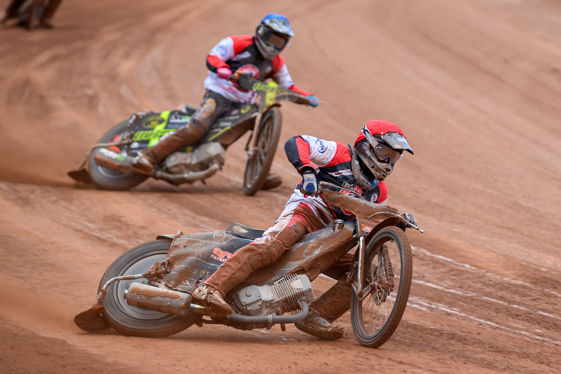 Belle Vue Colts' Jack Kingston  in Red leading team mate Connor King during the WSRA National Development League match between Belle Vue Colts and Oxford Chargers at the National Speedway Stadium, Manchester on Sunday 1st June 2025. (Photo: Ian Charles | MI News)