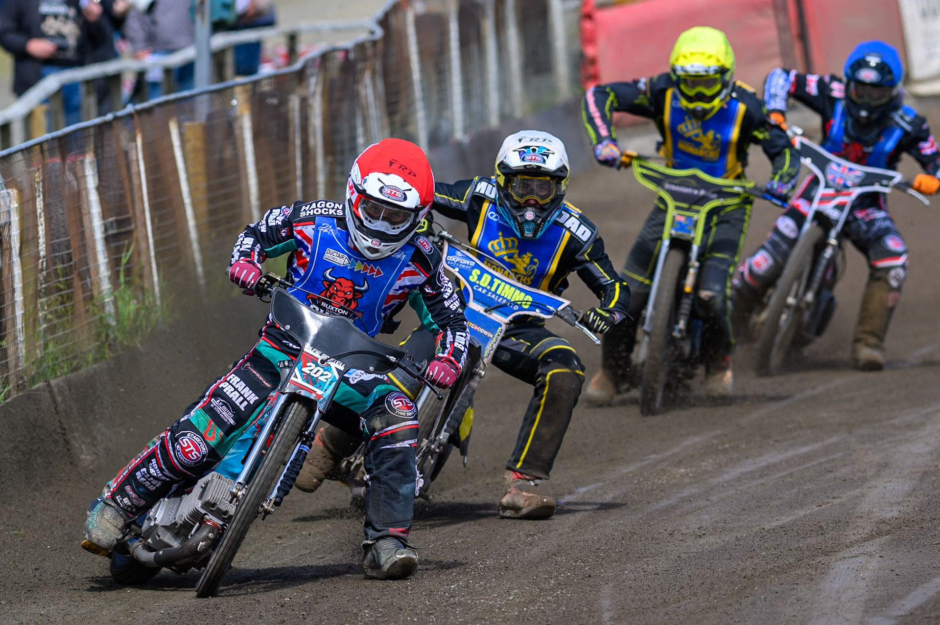 Alfie Bowtell of Buxton Bulls  in Red leading Dayle Wood of Edinburgh Monarchs Academy  in White Ben Whalley of Edinburgh Monarchs Academy   in Yellow and Jack Shimelt of Buxton Bulls  in Blue during the WSRA National Development League match between Buxton Bulls and Edinburgh Monarchs Academy at Hi-Edge Speedway, Buxton on Sunday 14th June 2026. (Photo: Ian Charles | MI News)