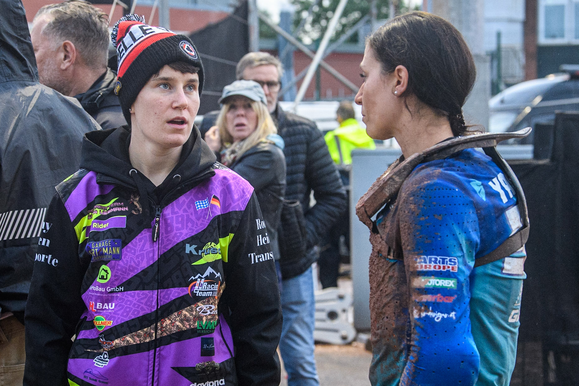 Celina Liebmann (left) chats with fellow Inn Isar Racing team member Yasmin Poppenreiter (93) from Austria during the FIM World Flat Track Championship Round 1 at the National Speedway Stadium, Manchester on Saturday 5th August 2023. (Photo: Ian Charles | MI News)