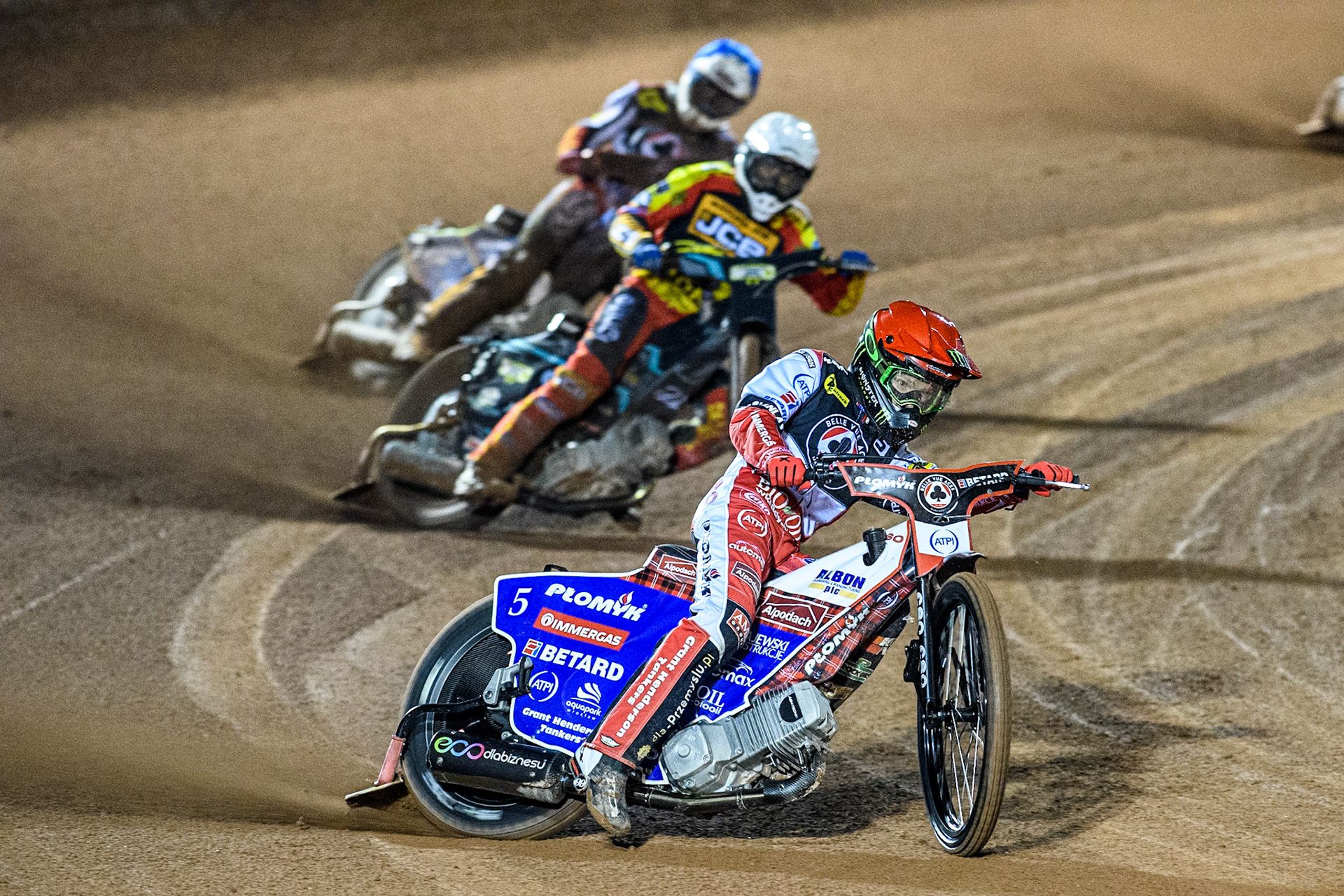 Belle Vue Aces' Dan Bewley  in Red leading Leicester Lions' Ryan Douglas  in White and Belle Vue Aces' Jake Mulford  in Blue during the Rowe Motor Oil Premiership Grand Final 1st Leg between Belle Vue Aces and Leicester Lions at the National Speedway Stadium, Manchester on Monday 23rd September 2024. (Photo: Ian Charles | MI News)