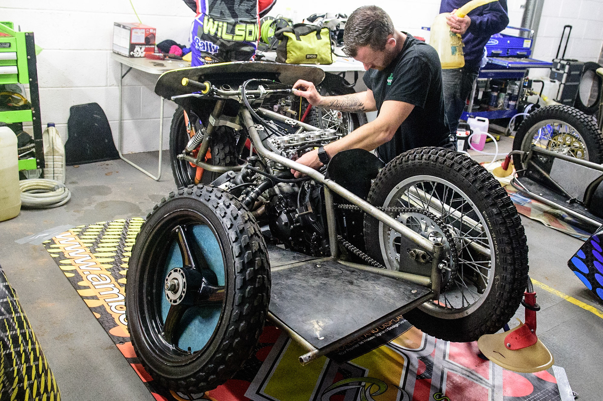 MANCHESTER, UK. OCT 30TH   A mechanic works on the sidecar of Tom Cossar &amp; Wayne Rickards  during the Manchester Masters Sidecar Speedway and Flat Track Racing at the National Speedway Stadium, Manchester on Saturday 30th October 2021. (Credit: Ian Charles | MI News)