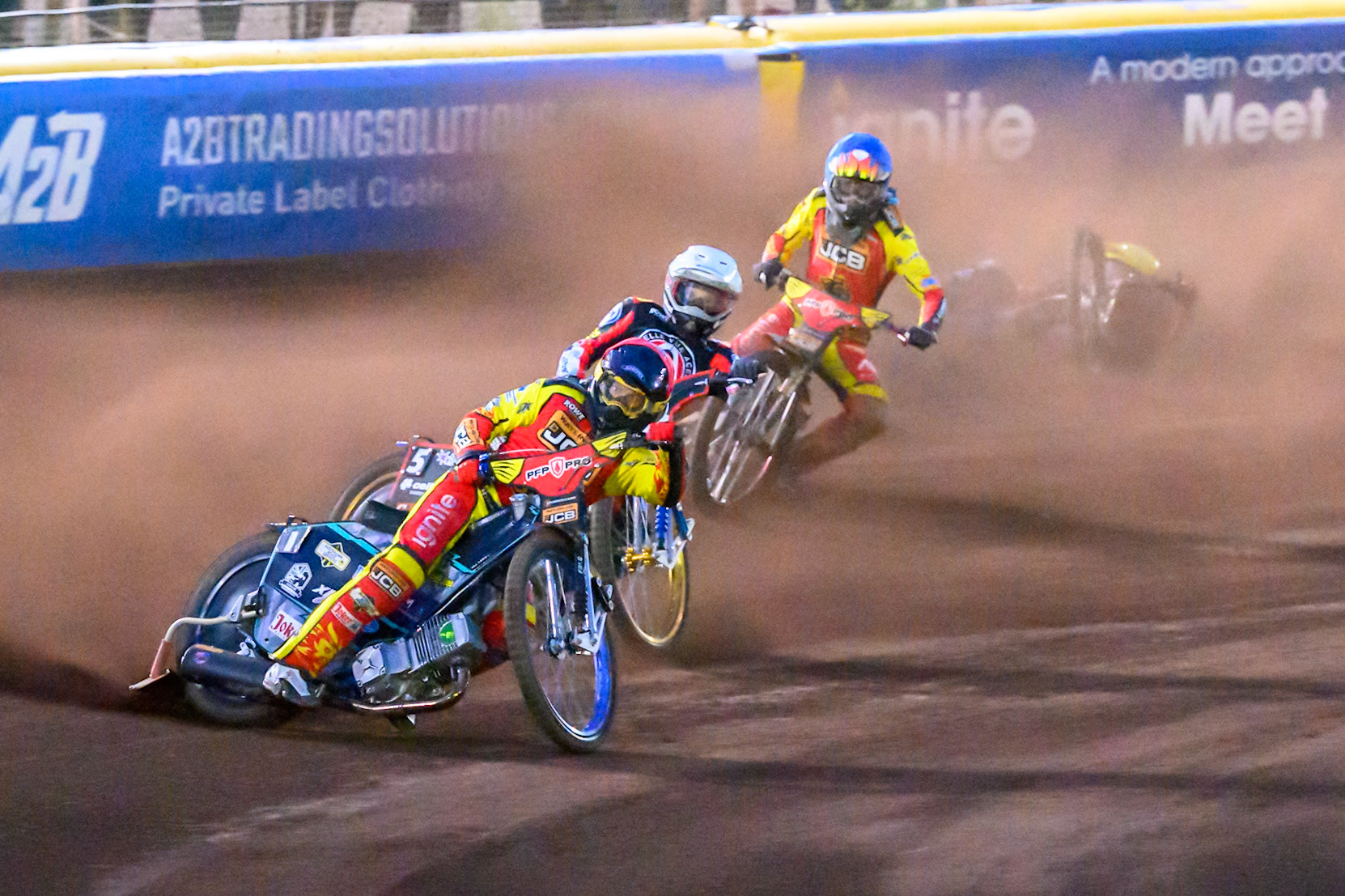 Ryan Douglas of Leicester Lions in Red leading Jason Doyle of Belle Vue Aces  in White  and Drew Kemp of Leicester Lions in Blue  as Tate Zischke of Belle Vue Aces  in Yellow  falls behind them during the Rowe Motor Oil Premiership match between Leicester Lions and Belle Vue Aces at the Hydroscan Arena, Leicester on Monday 7th September 2026. (Photo: Ian Charles | MI News)