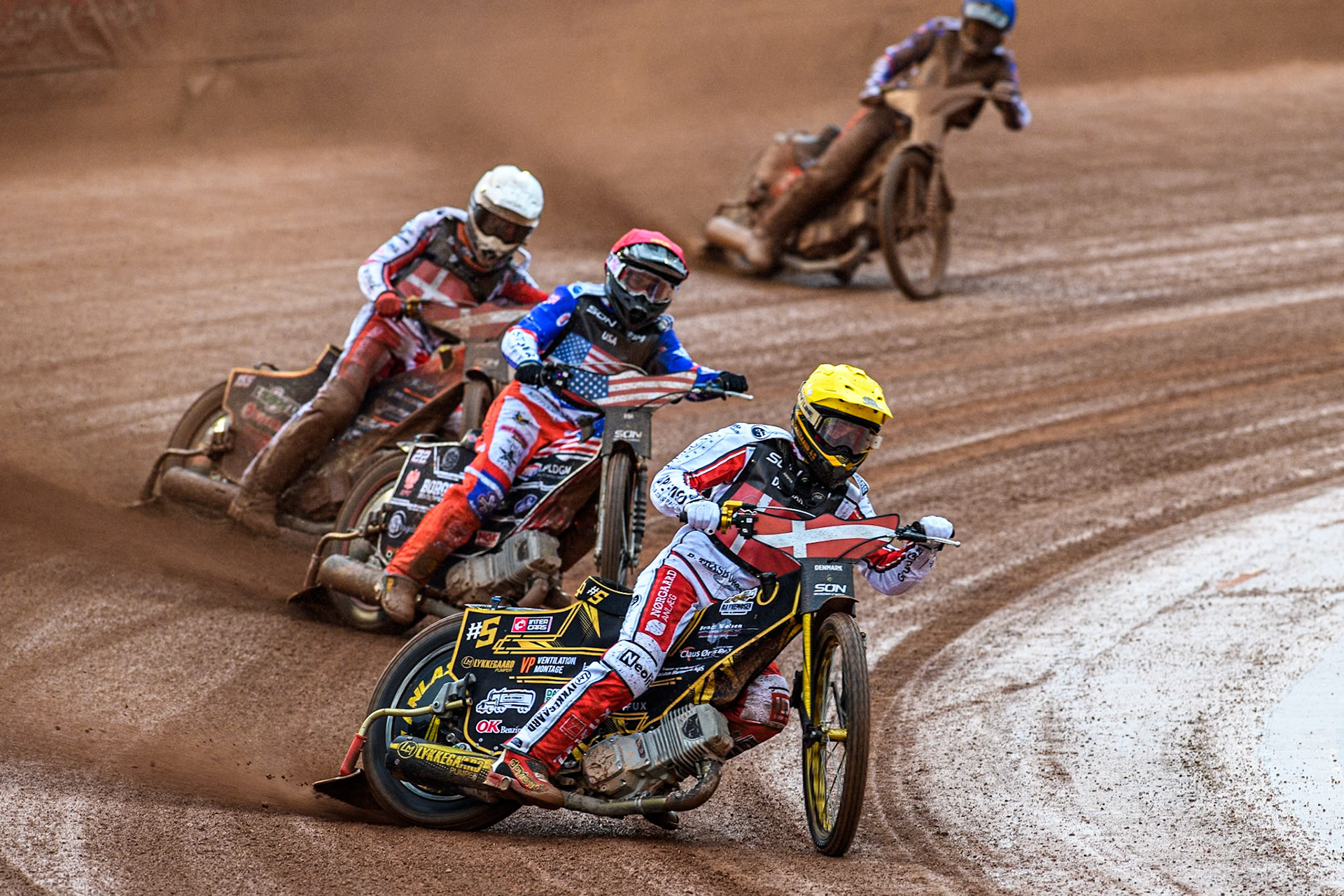 Anders Thomsen of Denmark in Yellow leading Broc Nicol of the USA in Red, Mikkel Michelsen of Denmark in White and Gino Manzares of the USA in Blue during the Monster Energy FIM Speedway of Nation Semi Final 2 at the National Speedway Stadium, Manchester on Wednesday 10th July 2024. (Photo: Ian Charles | MI News)