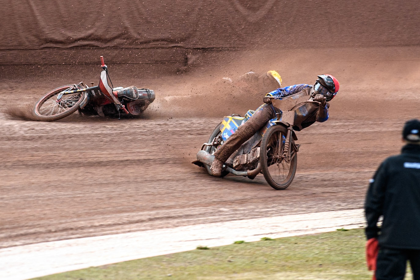 Bartosz Banbor of Poland falls behind Philip Hellström-Bängs of Sweden in Red during the Monster Energy FIM Speedway of Nations 2 (Under 21) Final at the National Speedway Stadium, Manchester on Friday 12th July 2024. (Photo: Ian Charles | MI News)