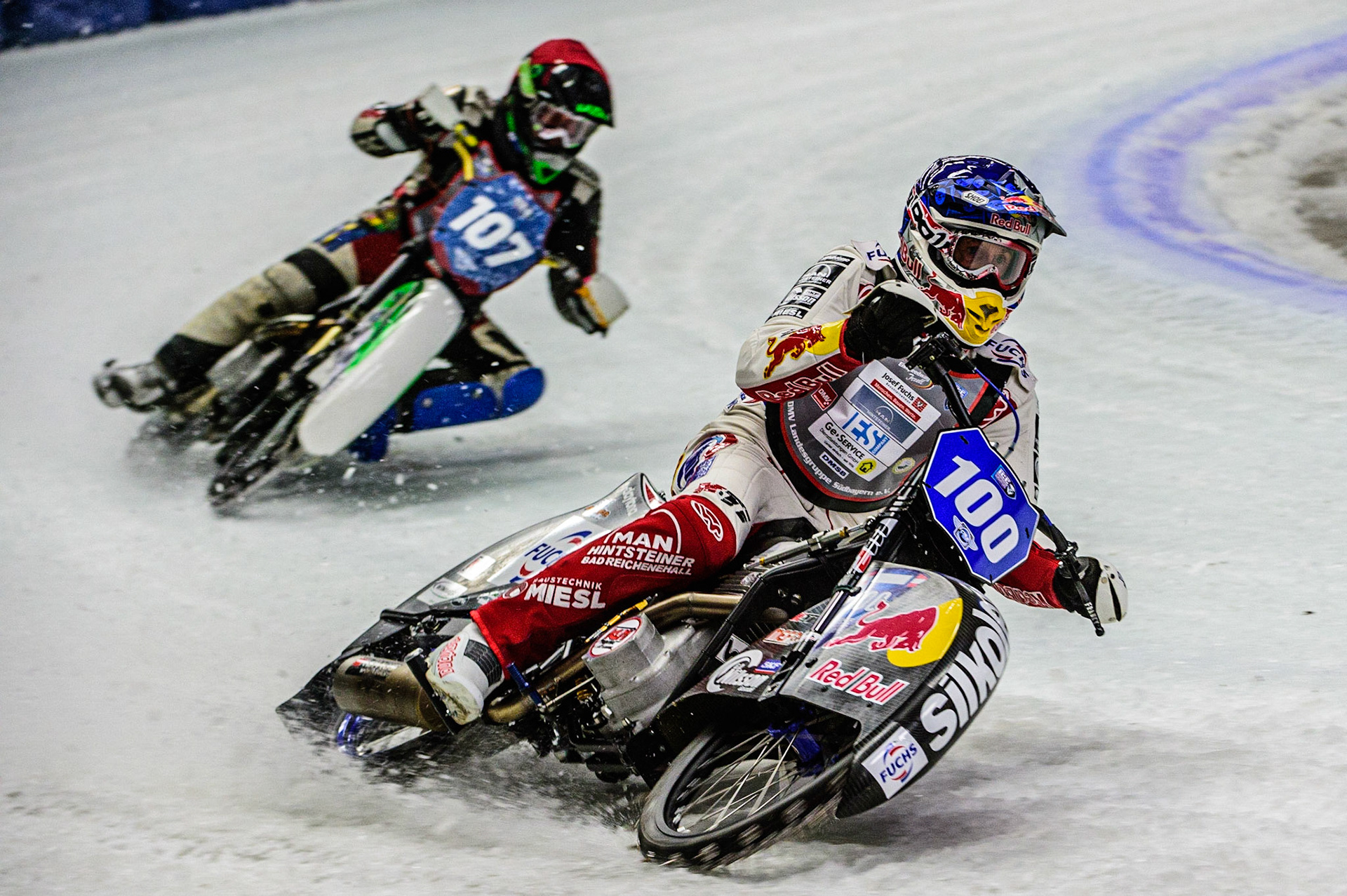 Franz Zorn (100) (Blue) leads Andrej Divis (107) (Red) during the Ice Speedway Gladiators World Championship Final 1 at Max-Aicher-Arena, Inzell, Germany on Saturday 18th March 2023. (Photo: Ian Charles | MI News)