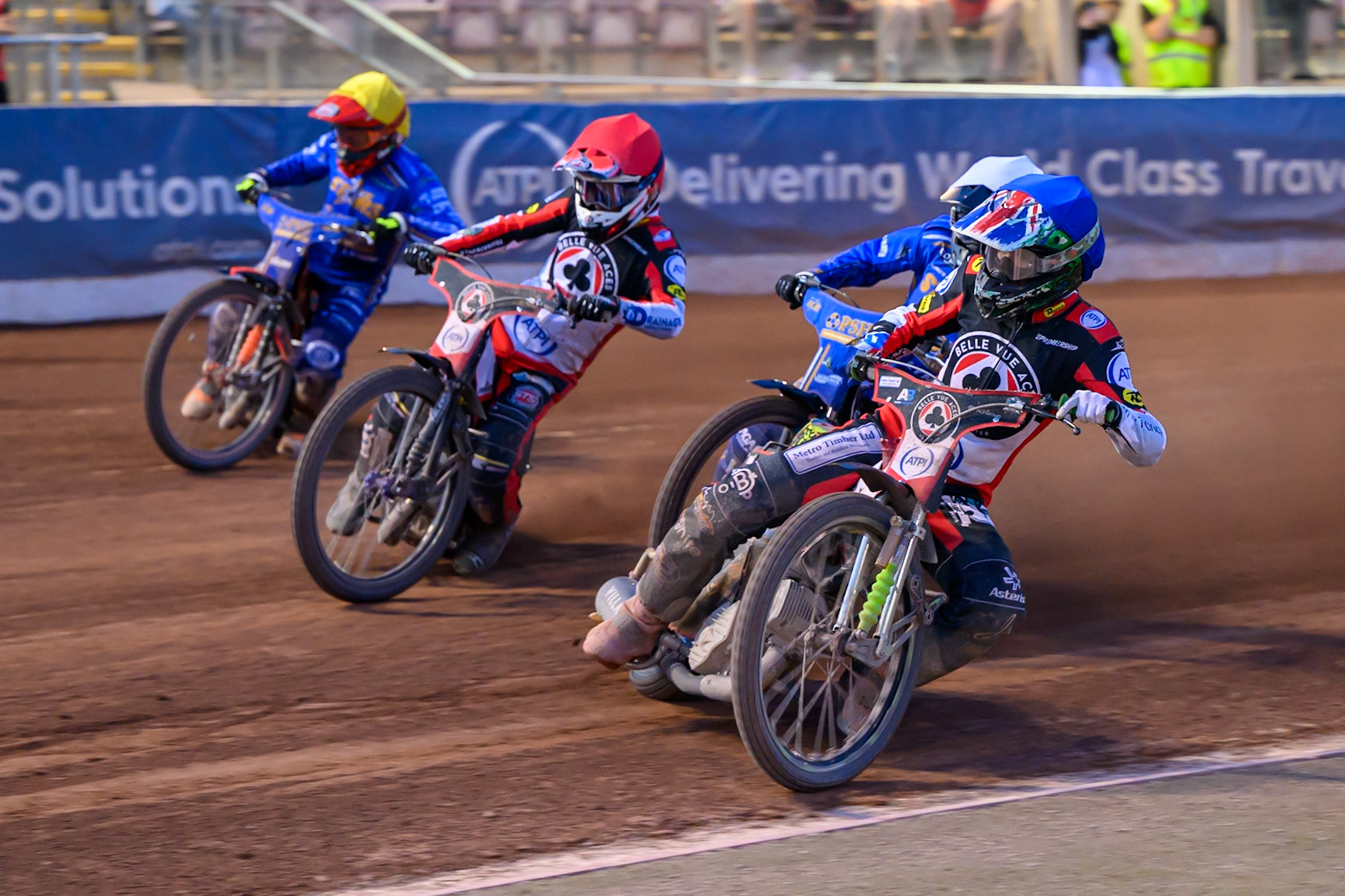 William Cairns of Belle Vue Aces in Blue on the inside of Ben Cook of Kings Lynn Stars in White , Zach Cook of Belle Vue Aces in Red  and Jordan Jenkins of Kings Lynn Stars in Yellow during the Rowe Motor Oil Premiership match between Belle Vue Aces and King's Lynn Stars at the National Speedway Stadium, Manchester on Monday 10th August 2026. (Photo: Ian Charles | MI News)