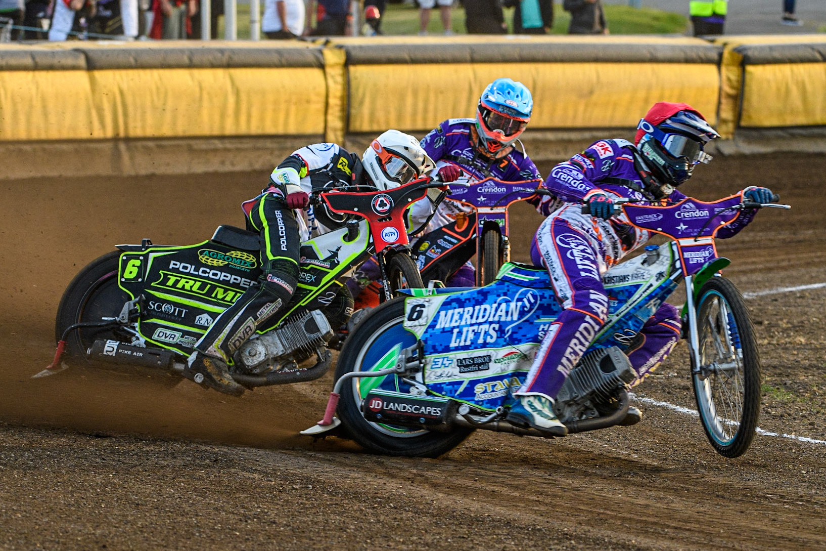Hans Andersen (Red) picks up some drive leading Keynan Rew (White) and Jordan Jenkins (Blue) during the Sports Insure Premiership match between Peterborough and Belle Vue Aces at East of England Showground, Peterborough on Monday 26th June 2023. (Photo: Ian Charles | MI News)