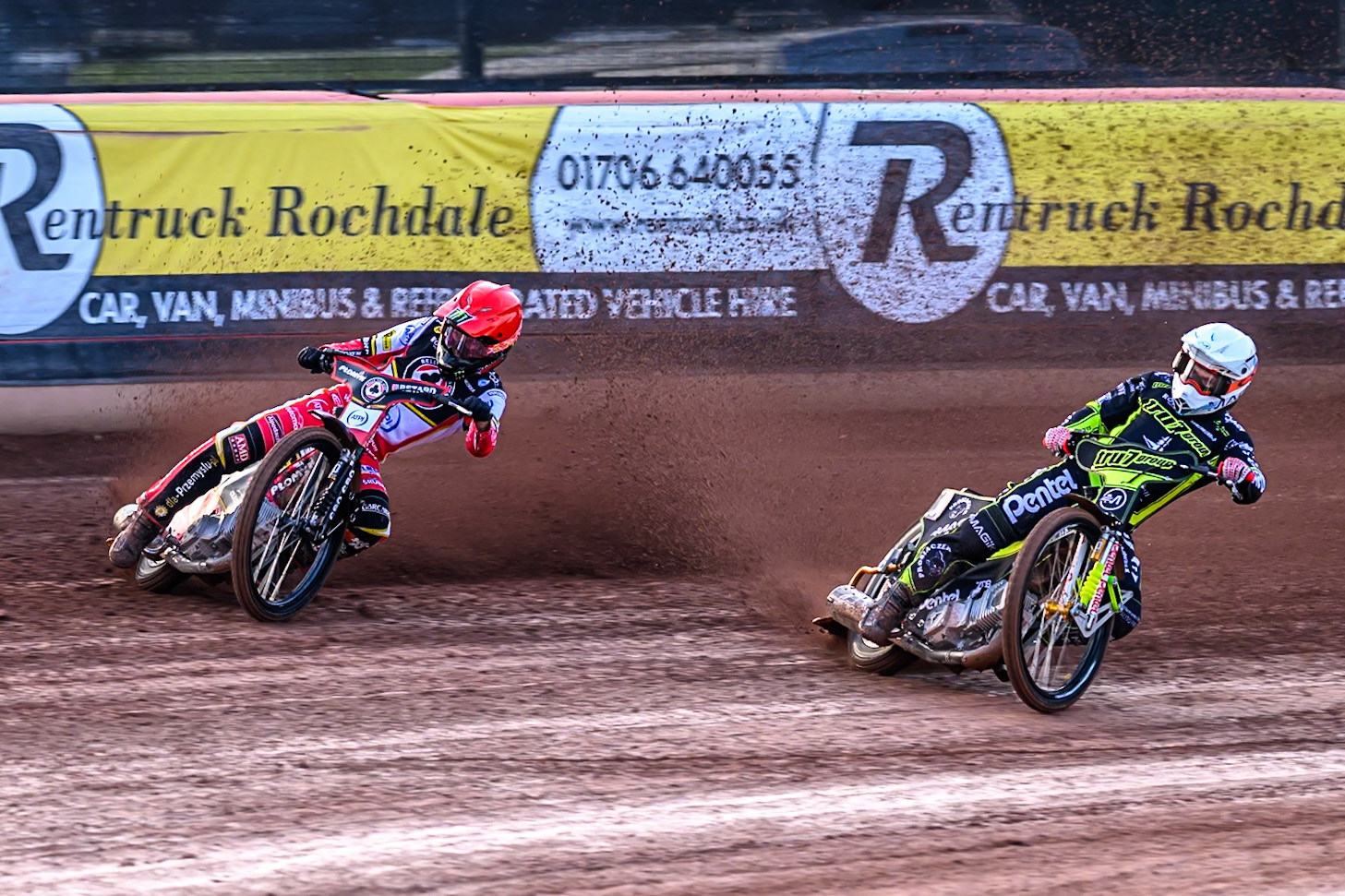 Ipswich Witches' Emil Saifutdinov in White rides inside Belle Vue Aces' Dan Bewley  in Red during the Rowe Motor Oil Premiership match between Belle Vue Aces and Ipswich Witches at the National Speedway Stadium, Manchester on Monday 30th June 2025. (Photo: Ian Charles | MI News)
