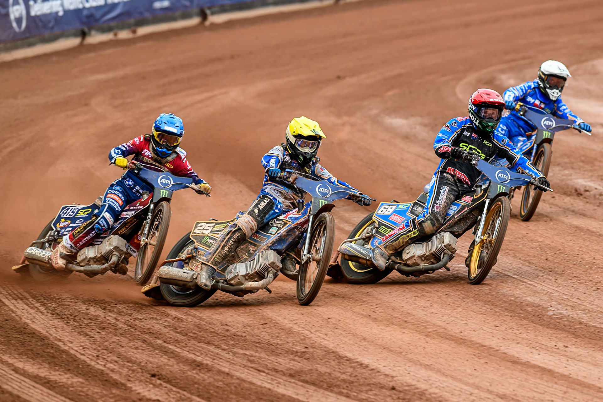 Jack Holder (25) of Australia in Yellow rides outside Jason Doyle (69) of Australia in Red, Bartosz Zmarzlik (95) of Poland in White with Dominik Kubera (415) of Poland in Blue behind during the ATPI FIM Speedway Grand Prix Round 4 at the National Speedway Stadium, Manchester, on Friday 13th June 2025. (Photo: Ian Charles | MI News)