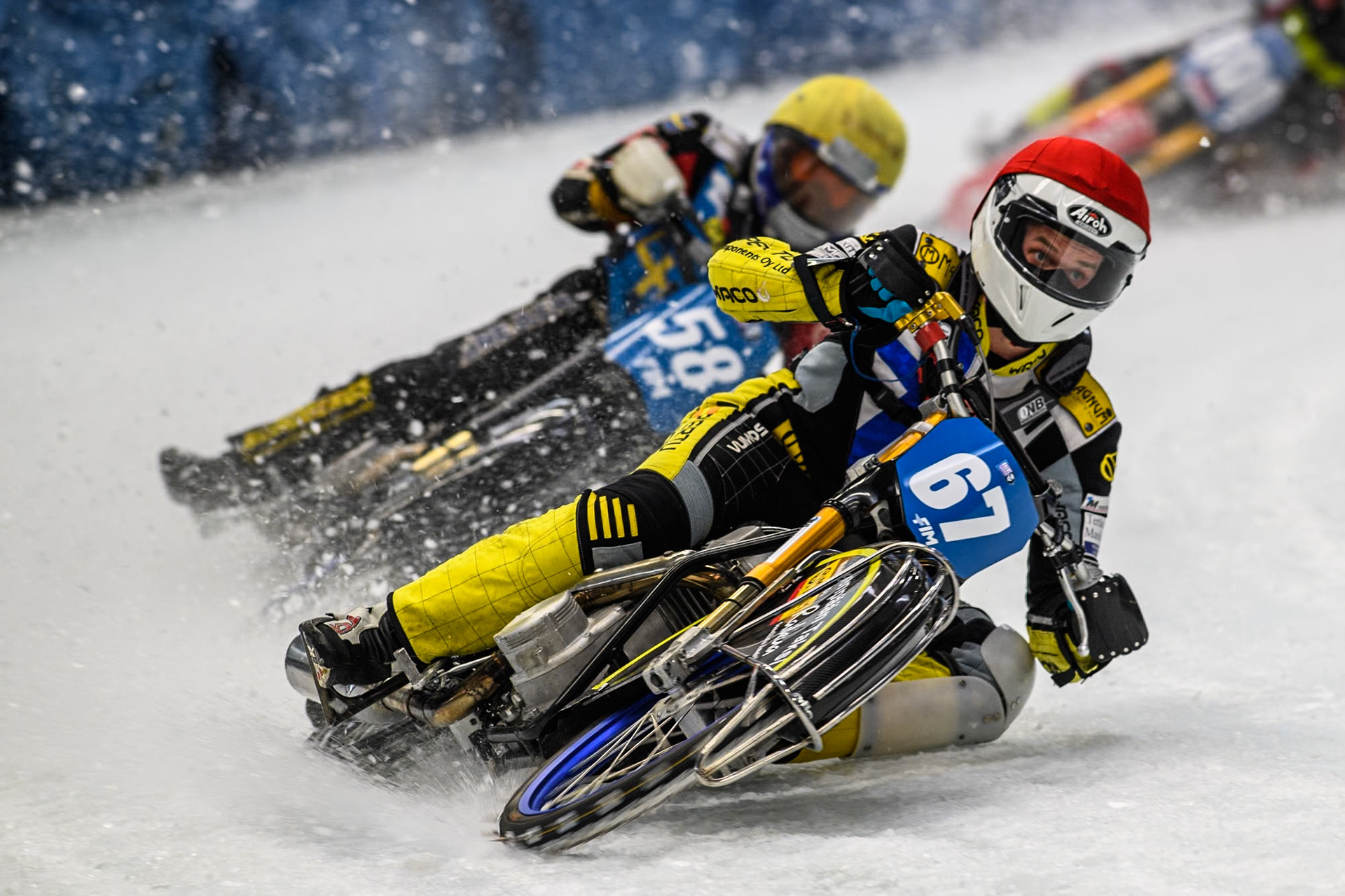 Finland's Heikki Huusko (67) (Red) leads  Sweden's Stefan Svensson (58) (Yellow) during the FIM Ice Speedway Gladiators World Championship Final 2 at the Max-Aicher-Arena, Inzell on Sunday 24 March 2024. (Photo: Ian Charles | MI News)