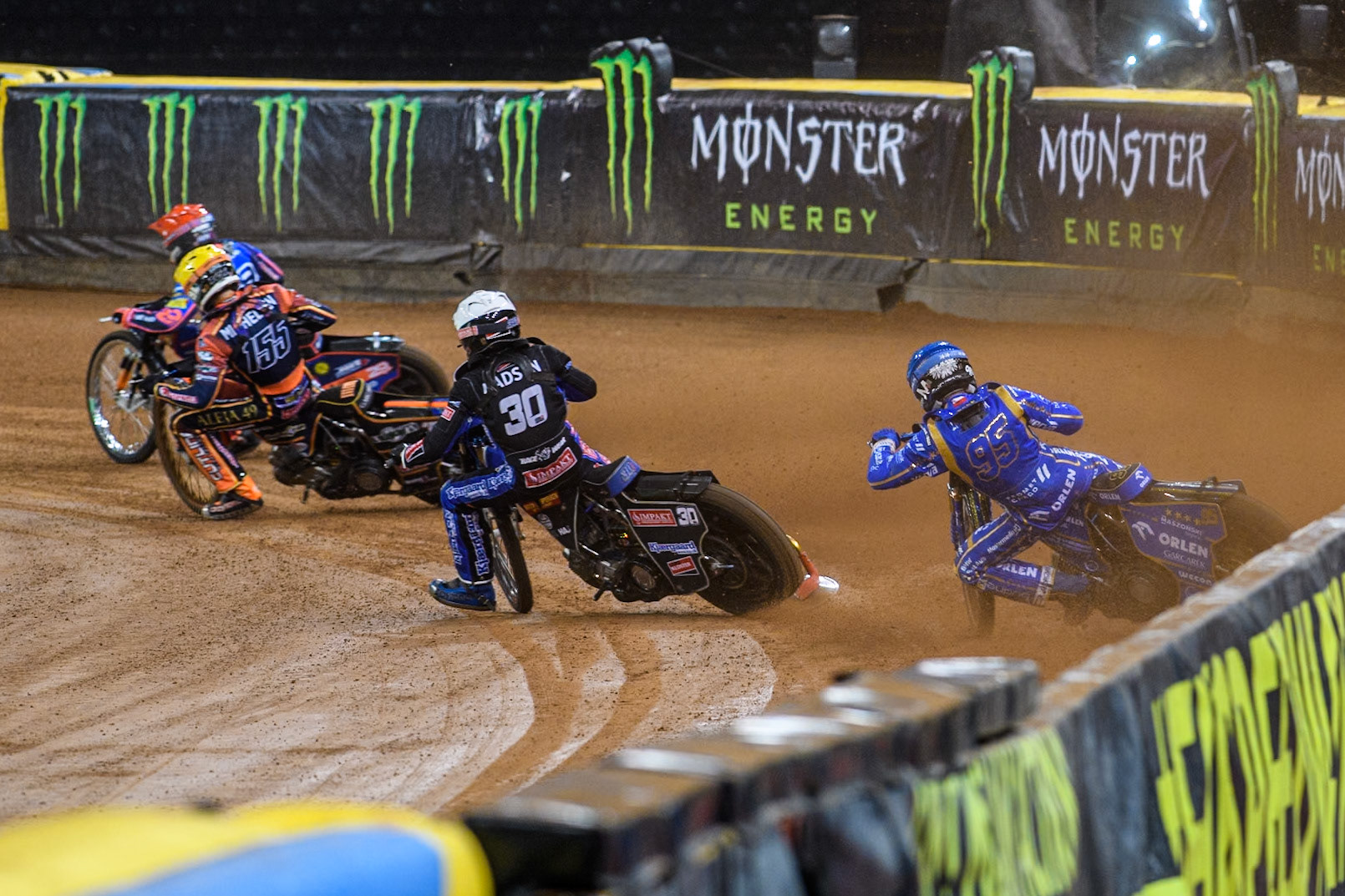 Bartosz Zmarzlik (95) of Poland  in Blue chases Leon Madsen (30) of Denmark in White, Mikkel Michelsen (155) of Denmark in Yellow and Andzejs Lebedevs (29) of Latvia in Red during the FIM Speedway Grand Prix of Great Britain at The Principality Stadium, Cardiff on Saturday 17th August 2024. (Photo: Ian Charles | MI News)