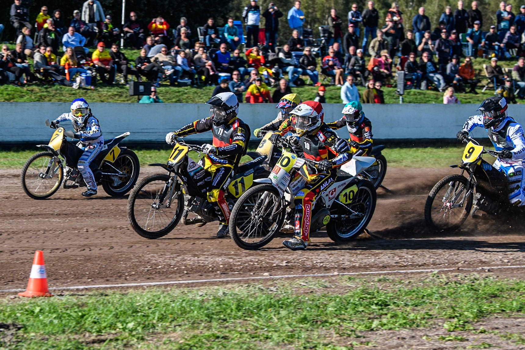 Martin Smolinski (Red) and Erik Riss (White) inside Tero Aarnio (Blue) lead the pack during the FIM Long Track Of Nations event at the Speed Centre Roden on Sunday 24th September 2023. (Photo: Ian Charles | MI News)