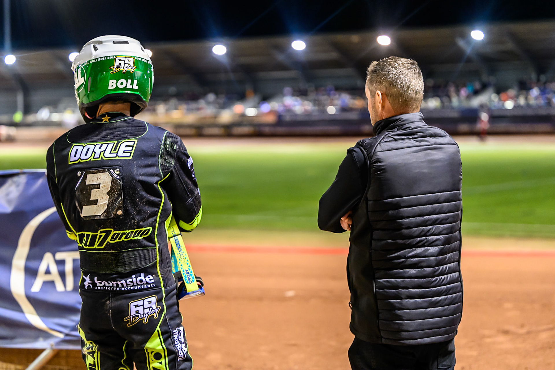 Jason Doyle of Ipswich Witches  (Left) watches the track prep with Ipswich Promoter Chris Louis during the Rowe Motor Oil Premiership Play Off Semi Final 1 (1st Leg)  between Belle Vue Aces and Ipswich Witches at the National Speedway Stadium, Manchester on Monday 8th September 2025. (Photo: Ian Charles | MI News)