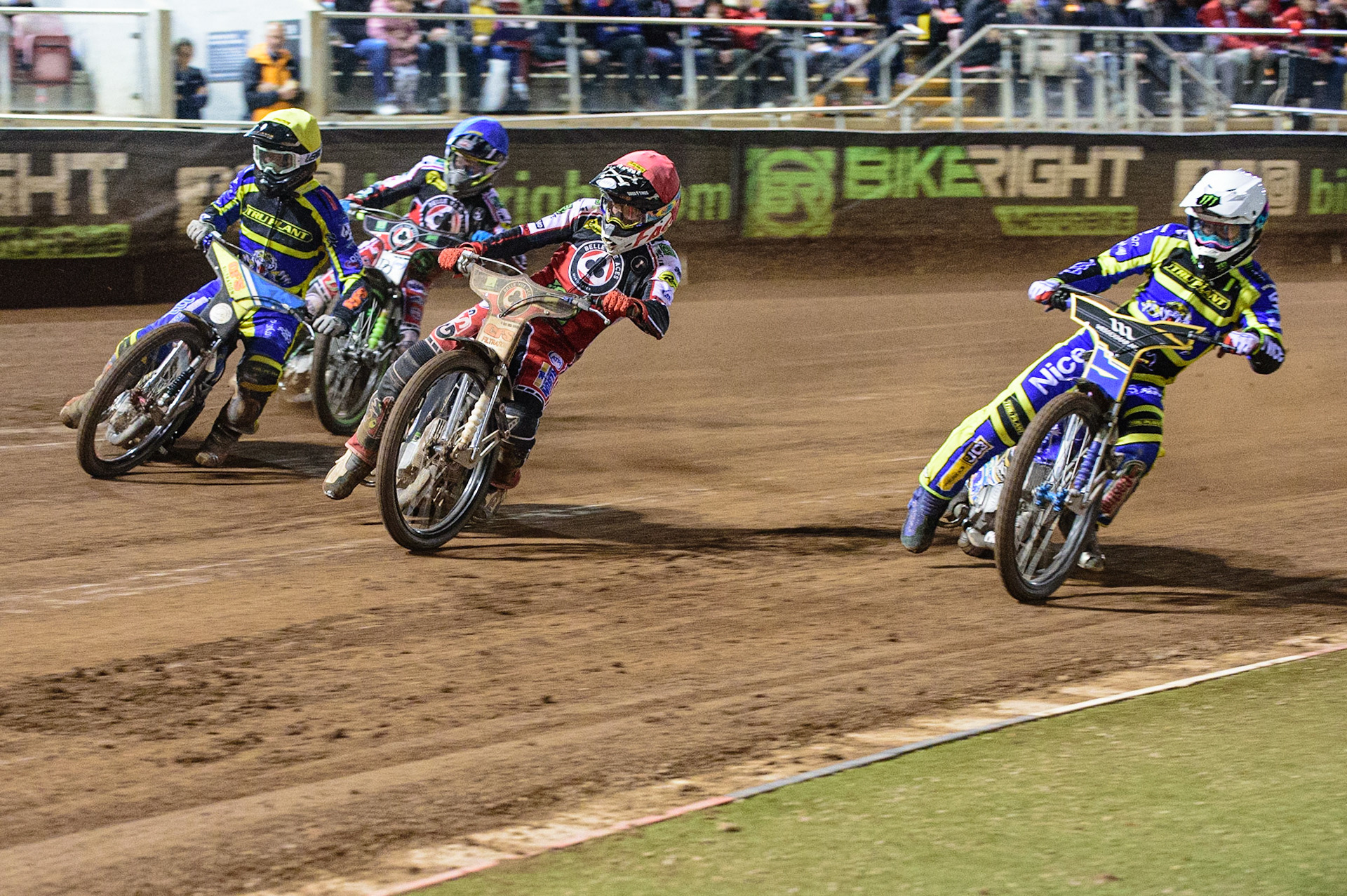 MANCHESTER, UK. OCT 7TH  Jack Holder  (White) inside Dan Bewley  (Red) and Adam Ellis  (Yellow) with Charles Wright  (Blue) behind during the SGB Premiership Play off Semi-Final Second Leg between Belle Vue Aces and Sheffield Tigers at the National Speedway Stadium, Manchester on Thursday 7th October 2021. (Credit: Ian Charles | MI News)