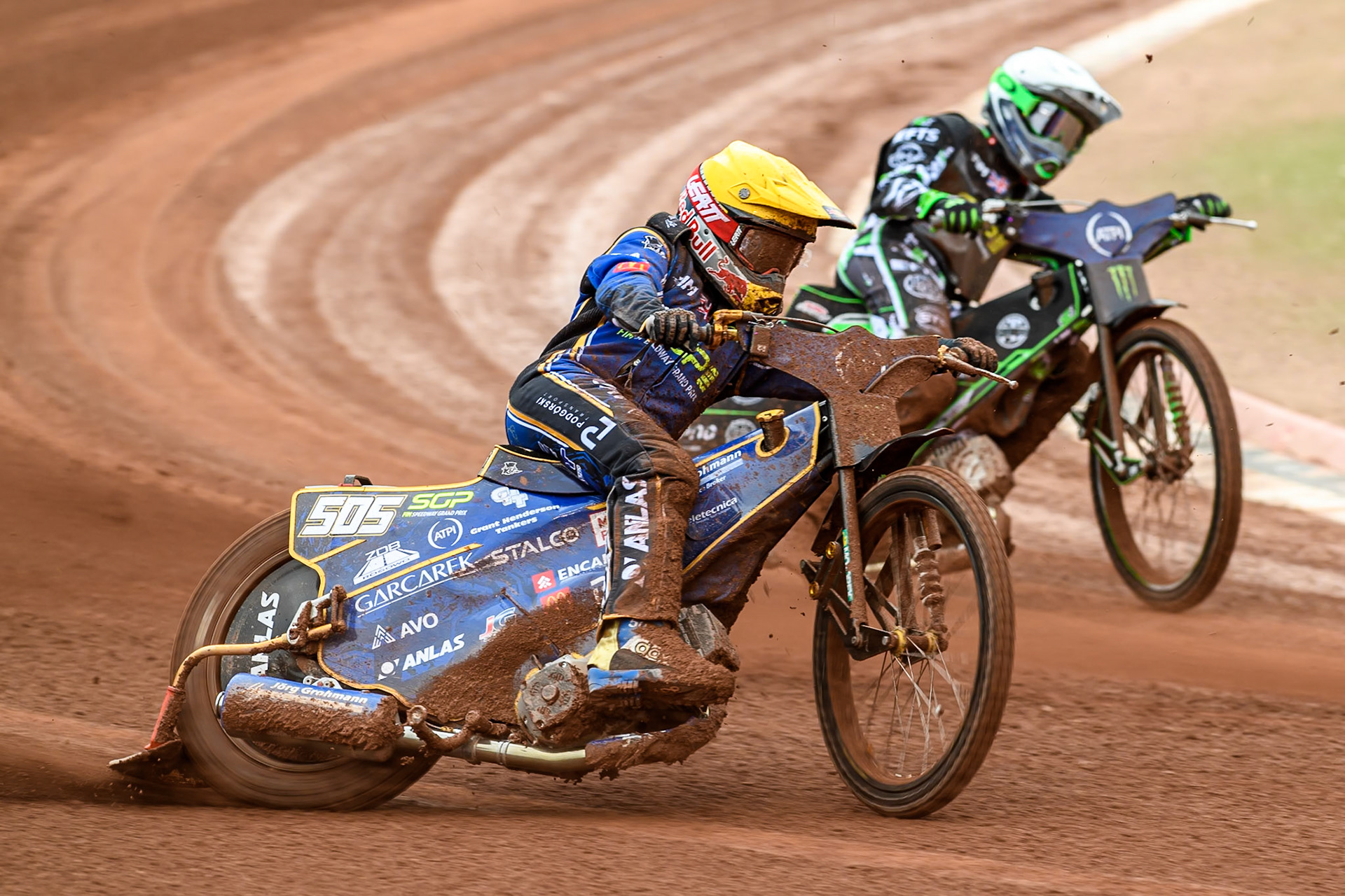 Robert Lambert (505) of Great Britain in Yellow rides outside Wild Card Charles Wright (16) of Great Britain in White during the ATPI FIM Speedway Grand Prix Round 4 at the National Speedway Stadium, Manchester, on Friday 13th June 2025. (Photo: Ian Charles | MI News)