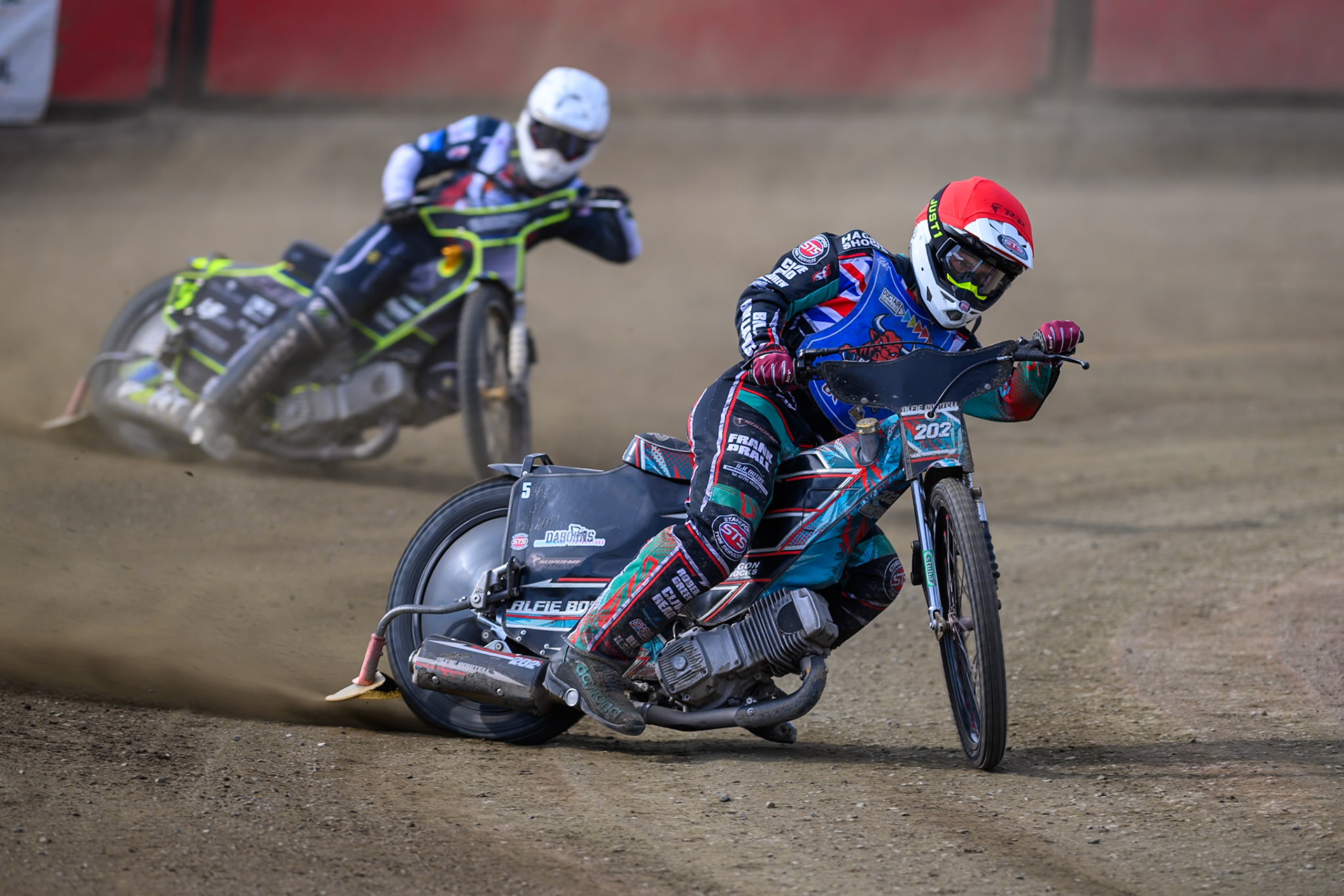 Alfie Bowtell of Buxton Bulls in Red leading Nathan Ablitt of Middlesborough Tigers in White during the WSRA National Development League match  between Buxton Bulls and Middlesborough Tigers at Hi-Edge Speedway, Buxton on Sunday 16th August 2026. (Photo: Ian Charles | MI News)