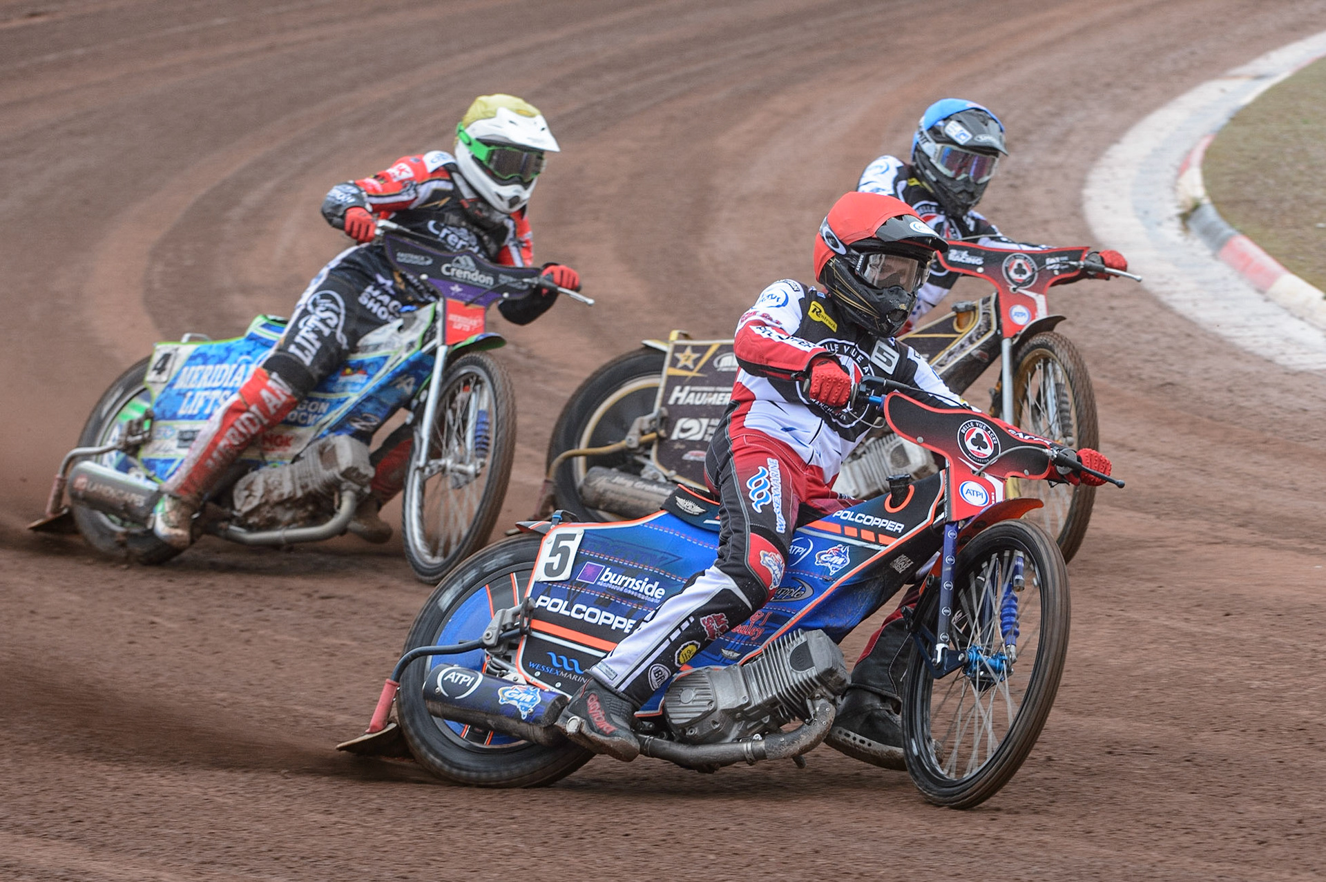 MANCHESTER, UK. MAY 2ND  Brady Kurtz  (Red) leads Tom Brennan  (Blue) and Hans Andersen   (Yellow) during the SGB Premiership match between Belle Vue Aces and Peterborough at the National Speedway Stadium, Manchester on Monday 2nd May 2022. (Credit: Ian Charles | MI News)