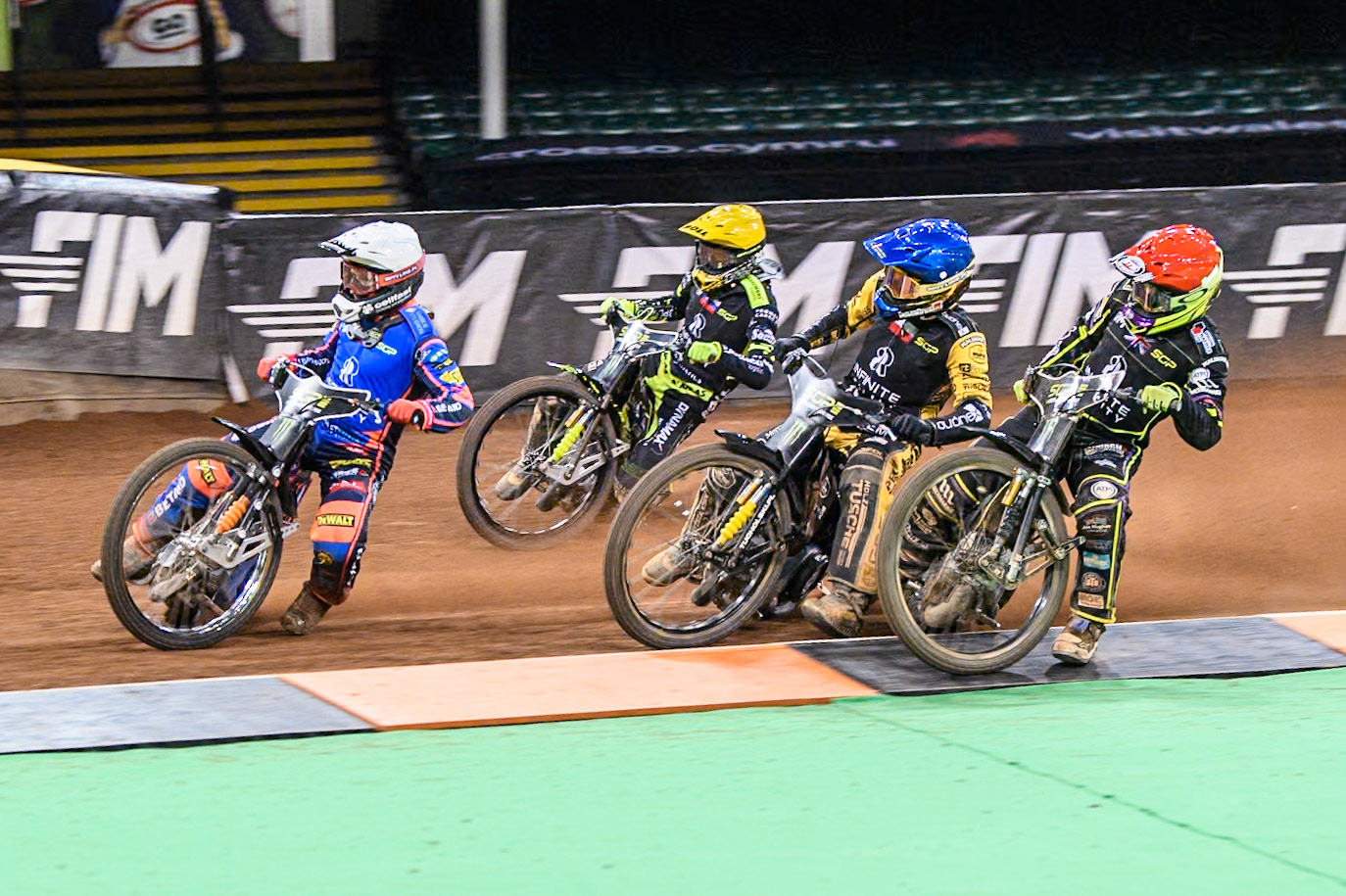 Andzejs Lebedevs (29) of Latvia in White leading Tom Brennan (16) Wild card rider of Great Britain in Red, Szymon Woźniak (48) of Poland in Blue and Martin Vaculik (54) of Slovakia in Yellow during the FIM Speedway Grand Prix of Great Britain at The Principality Stadium, Cardiff on Saturday 17th August 2024. (Photo: Ian Charles | MI News)