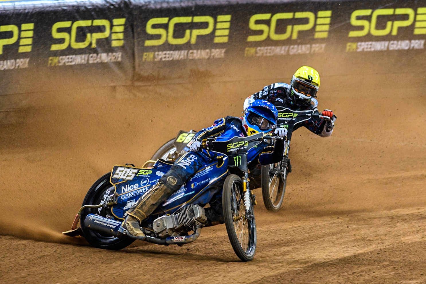 Robert Lambert (505) of Great Britain in Blue leading Fredrik Lindgren (66) of Sweden in Yellow during the FIM Speedway Grand Prix of Great Britain at The Principality Stadium, Cardiff on Saturday 17th August 2024. (Photo: Ian Charles | MI News)