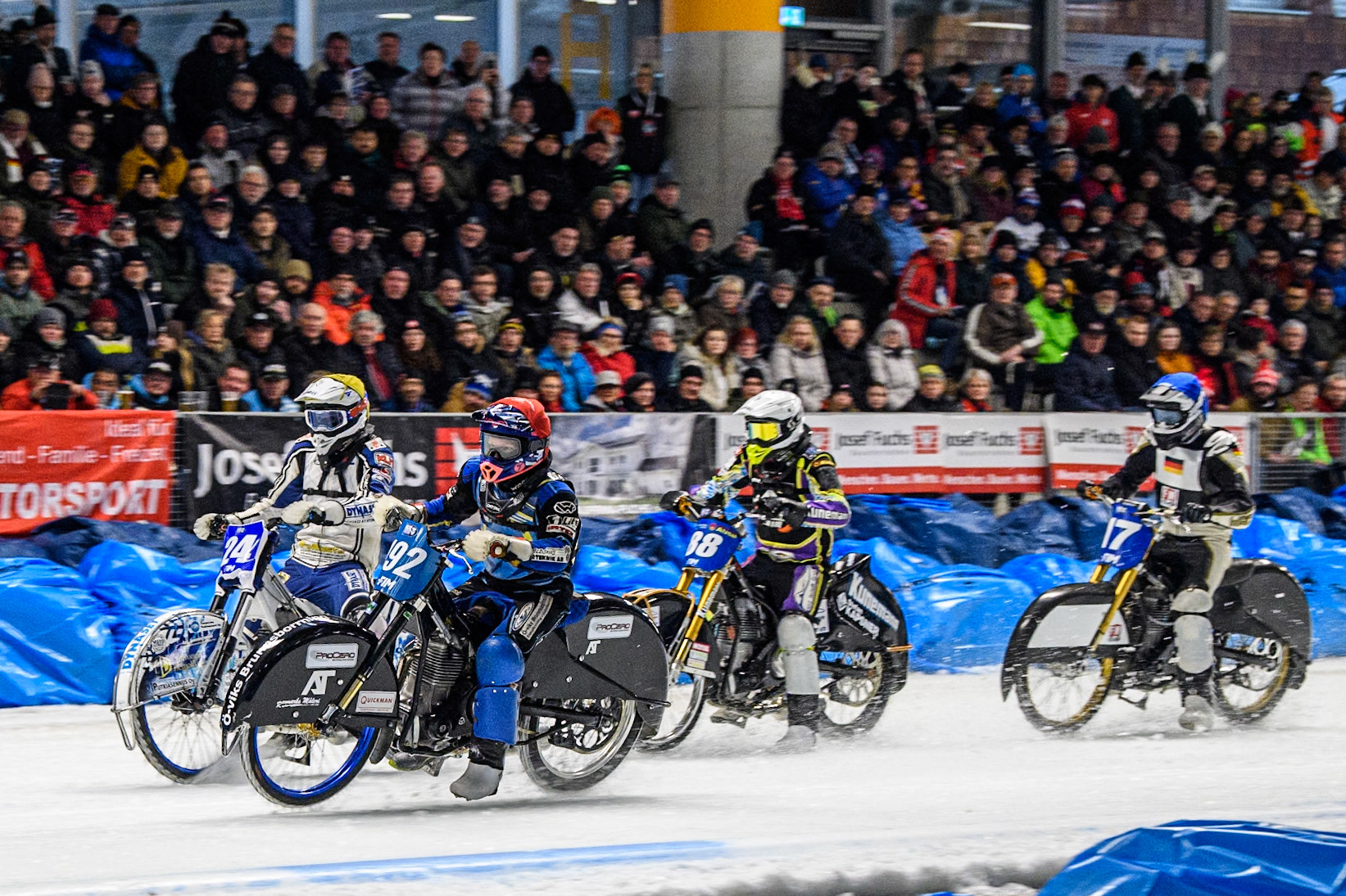Niclas Svensson (192) of Sweden in Red rides inside Max Koivula (24) of Finland in Yellow with Max Niedermaier  (88) of Germany in White and Reserve Franz Mayerbüchler (17) of Germany in Blue behind during the Ice Speedway Gladiators World Championship Final 2 at Max-Aicher-Arena, Inzell on Sunday 16th March 2025. (Photo: Ian Charles | MI News)