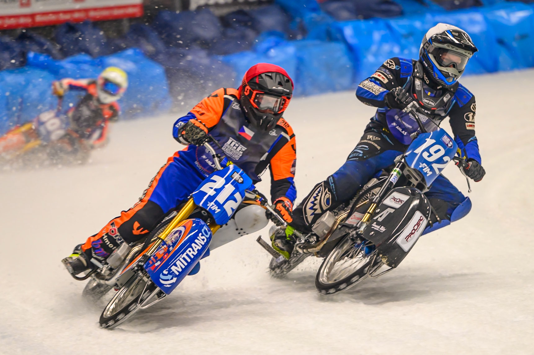 Niclas Svensson (192) of Sweden  in White shoves Lukas Hutla (212) of Czechia in Red out to pass him with Johann Weber (33) of Germany  in Blue on the outside during the Ice Speedway Gladiators World Championship Final 1 at Max-Aicher-Arena, Inzell on Saturday 14th March 2026. (Photo: Ian Charles | MI News)