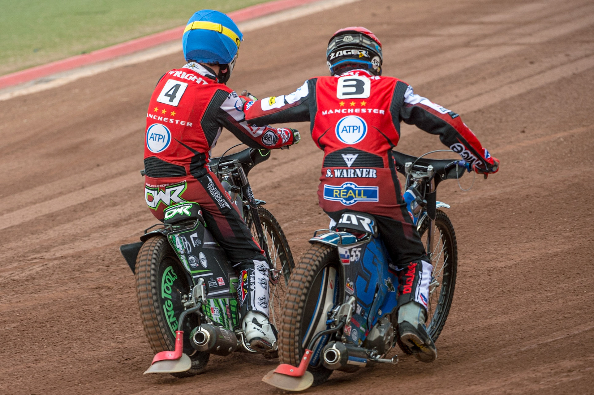 MANCHESTER, UK. JUN 13TH Charles Wright  (Blue) and Matej Zagar  congratulate each other on their maximum heat win during the SGB Premiership match between Belle Vue Aces and Wolverhampton  Wolves at the National Speedway Stadium, Manchester on Monday 13th June 2022. (Credit: Ian Charles | MI News)