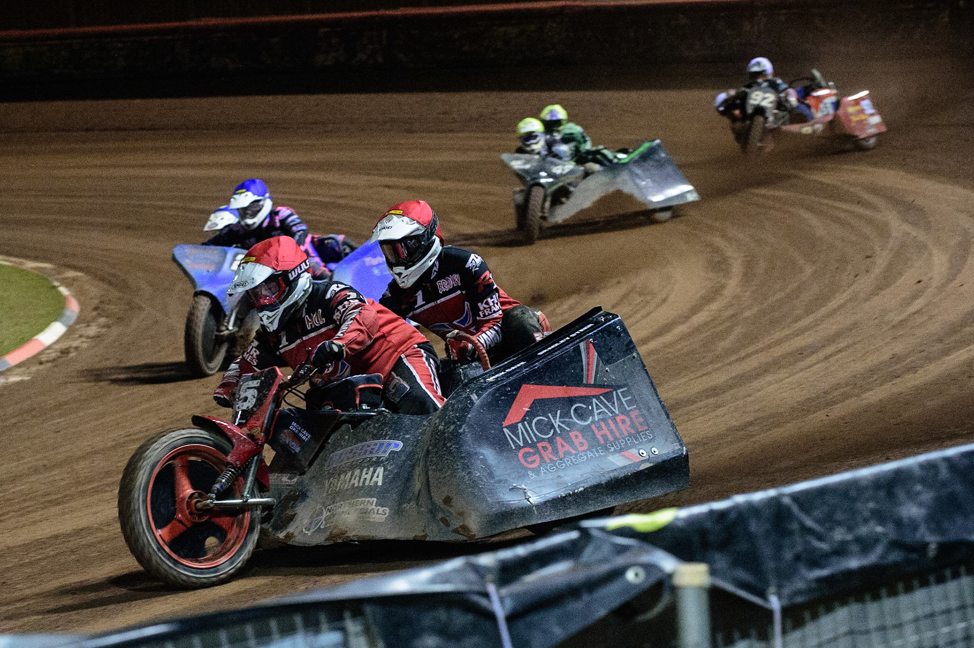 MANCHESTER, UK. OCT 30TH   Mick Cave &amp; Bradley Steer  (Red) leads Will Penfold &amp; Ricky Pay  (Blue) Gareth Winterburn &amp; Bradley Atkinson  (Yellow) and Paul Whitelam &amp; Richard Webb (White) in the last chance semi final during the Manchester Masters Sidecar Speedway and Flat Track Racing at the National Speedway Stadium, Manchester on Saturday 30th October 2021. (Credit: Ian Charles | MI News)