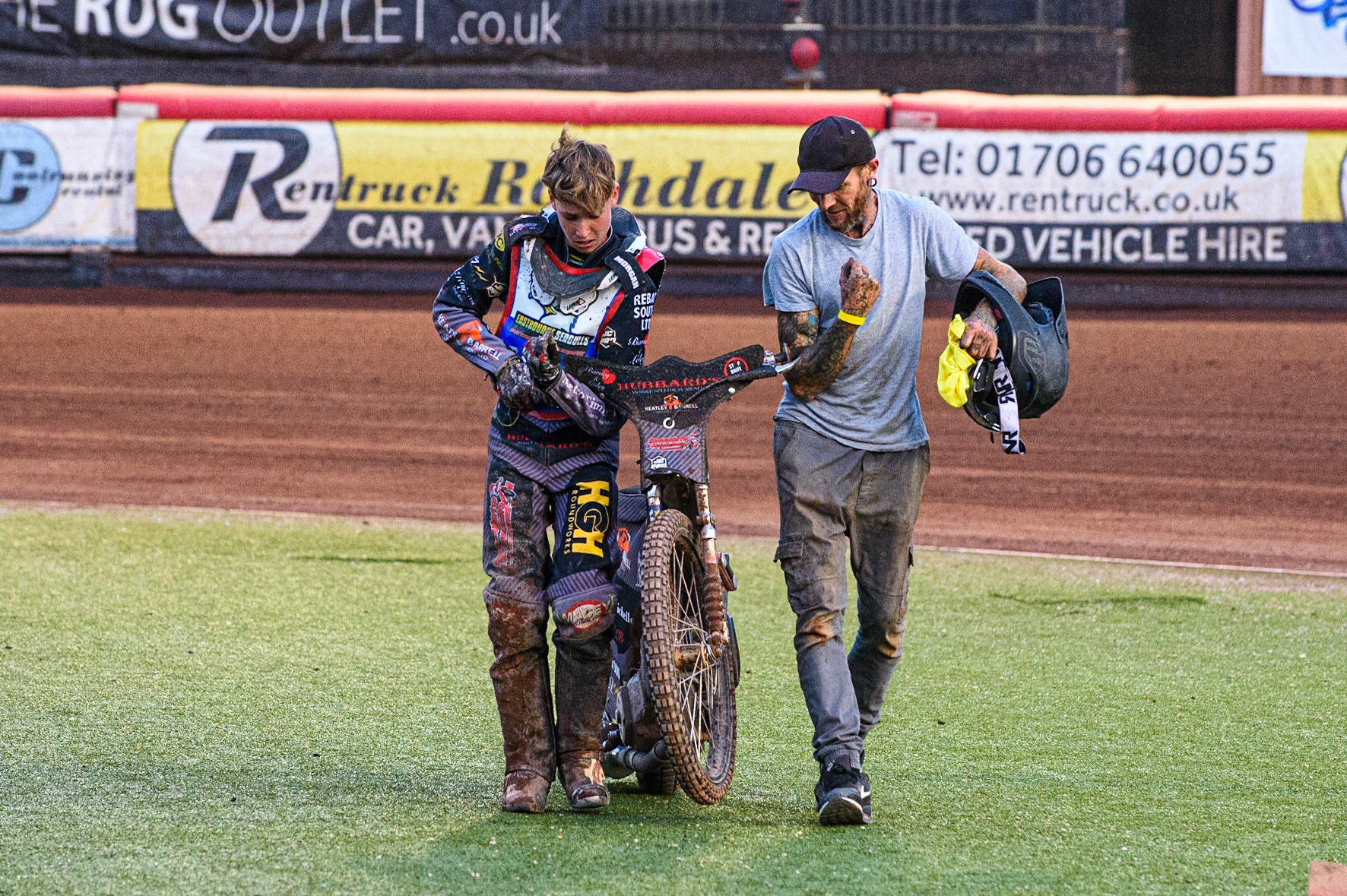 MANCHESTER, UK. JULY 23RD Vinnie Foord   and his mechanic carry the damaged bike back to the pits after his heat 9 fall during the National Development League match between Belle Vue Colts and Eastbourne Seagulls at the National Speedway Stadium, Manchester on Friday 23rd July 2021. (Credit: Ian Charles | MI News)