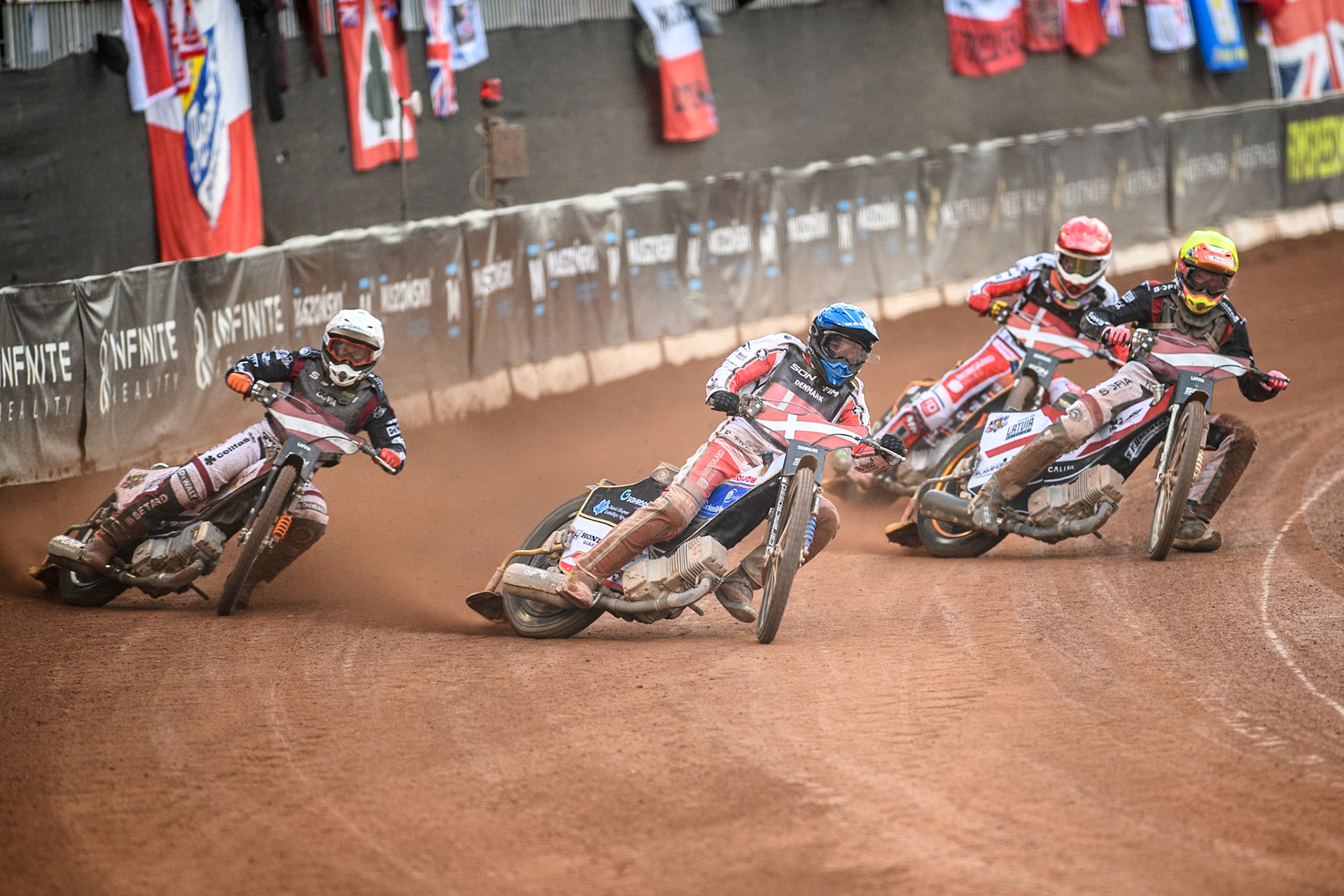 DENMARK v LATVIA Rasmus Jensen of Denmark in Blue leading Daniils Kolodinskis of Latvia in Yellow, Andzejs Lebedevs of Latvia in White and Mikkel Michelsen of Denmark in Red during the Monster Energy FIM Speedway of Nation Final at the National Speedway Stadium, Manchester on Saturday 13th July 2024. (Photo: Ian Charles | MI News)