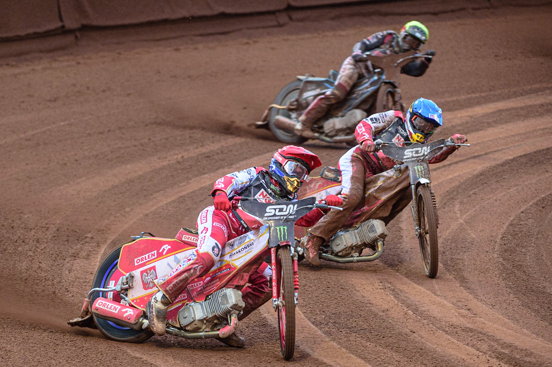 MANCHESTER, UK. OCT 17TH Bartosz Zmarzlik of Poland (Red) leads team mate Maciej Janowski (Blue) with Francis Gusts of Latvia (Yellow) behind during the Monster Energy FIM Speedway of Nations at the National Speedway Stadium, Manchester on Sunday  17th October 2021. (Credit: Ian Charles | MI News)