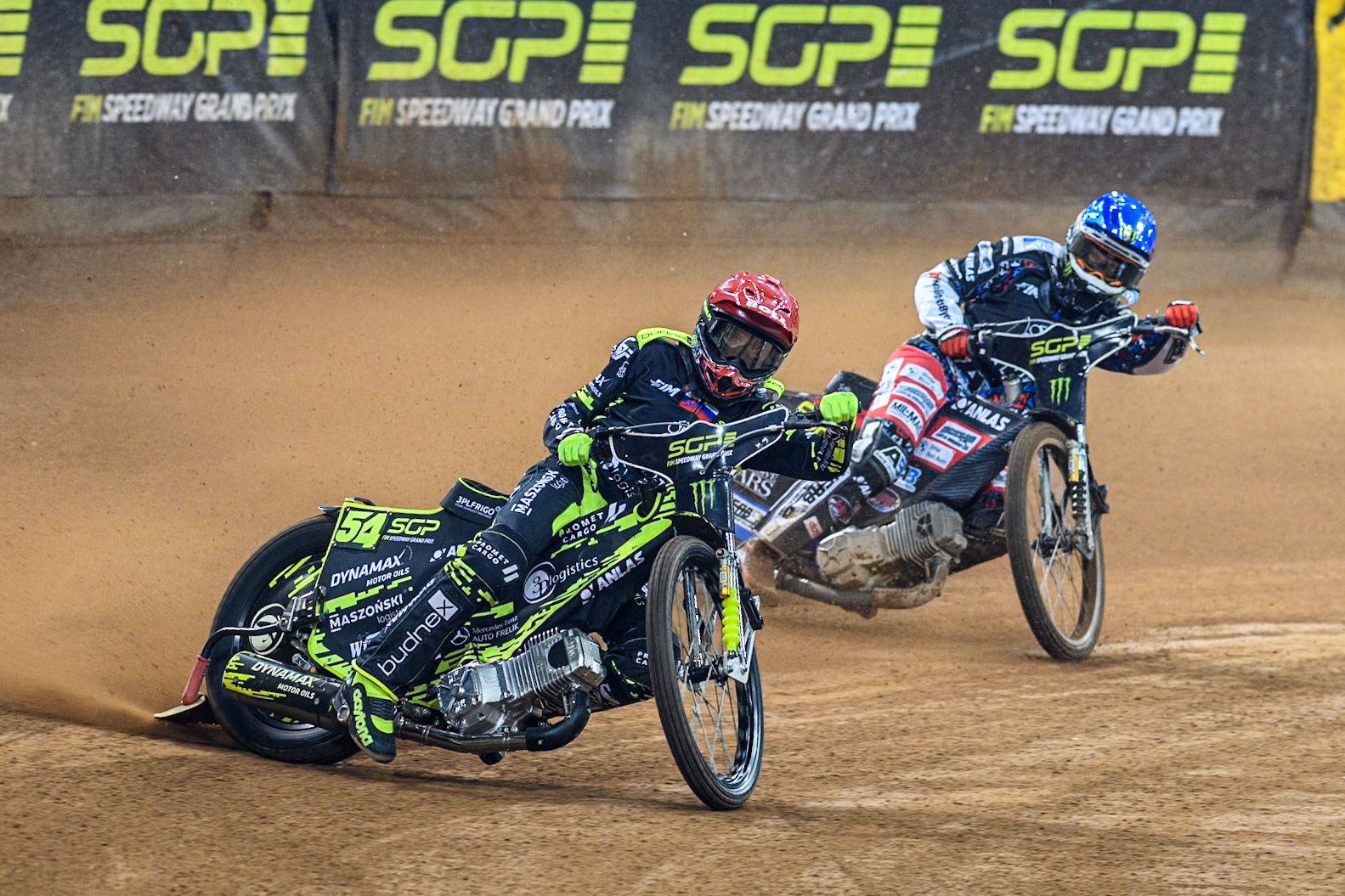 Martin Vaculik (54) of Slovakia in Red leading Fredrik Lindgren (66) of Sweden in Blue during the FIM Speedway Grand Prix of Great Britain at The Principality Stadium, Cardiff on Saturday 17th August 2024. (Photo: Ian Charles | MI News)