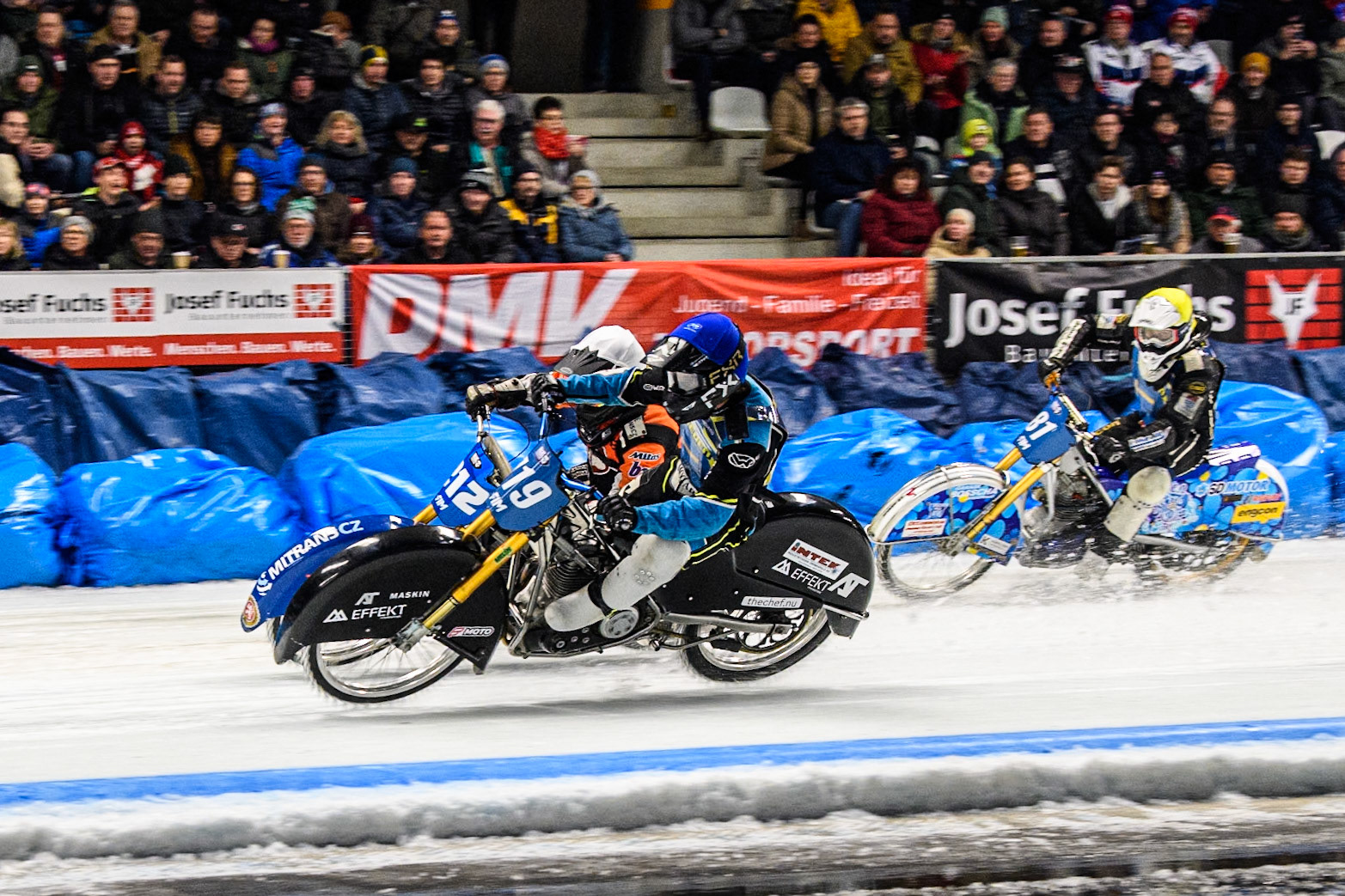 Filip Jäger (719) of Sweden in Blue rides inside Lukas Hutla (212) of the Czech Republic in White with Jimmy Olsén (81) of Sweden in Yellow behind during the Ice Speedway Gladiators World Championship Final 2 at Max-Aicher-Arena, Inzell on Sunday 16th March 2025. (Photo: Ian Charles | MI News)
