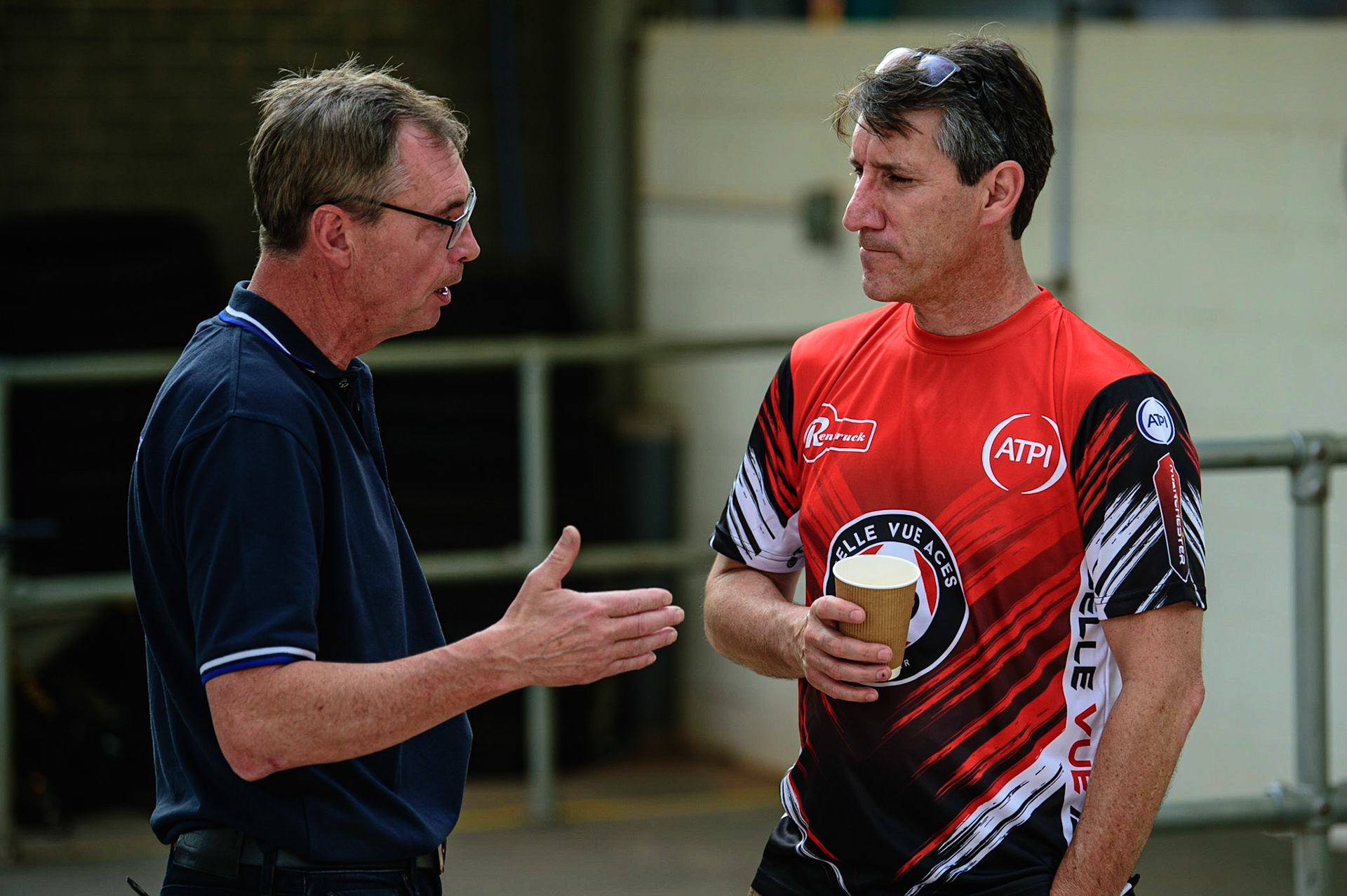 MANCHESTER UK Belle Vue ATPI Aces  Manager Mark Lemon  (right) chats with Eurosport commentator Kelvin Tatum  during the SGB Premiership match between Belle Vue Aces and King's Lynn Stars at the National Speedway Stadium, Manchester on Monday 11th July 2022. (Credit: Ian Charles | MI News)